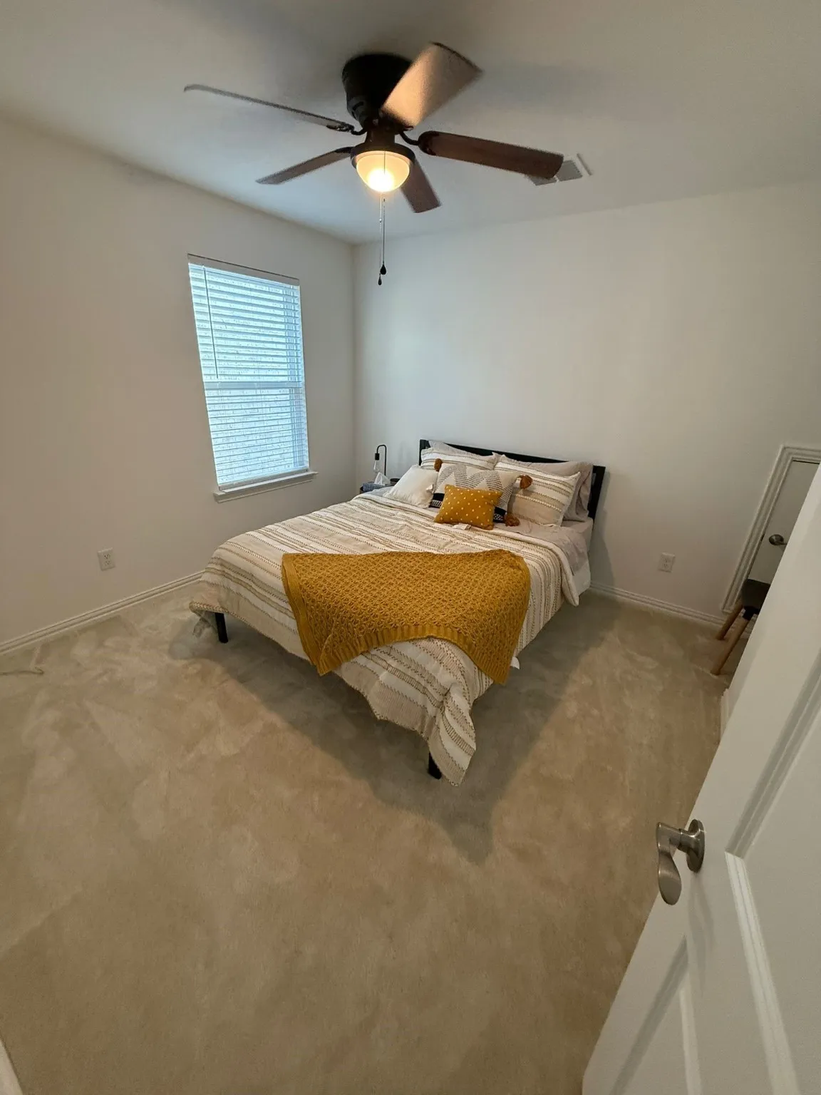 Bedroom featuring carpet and ceiling fan