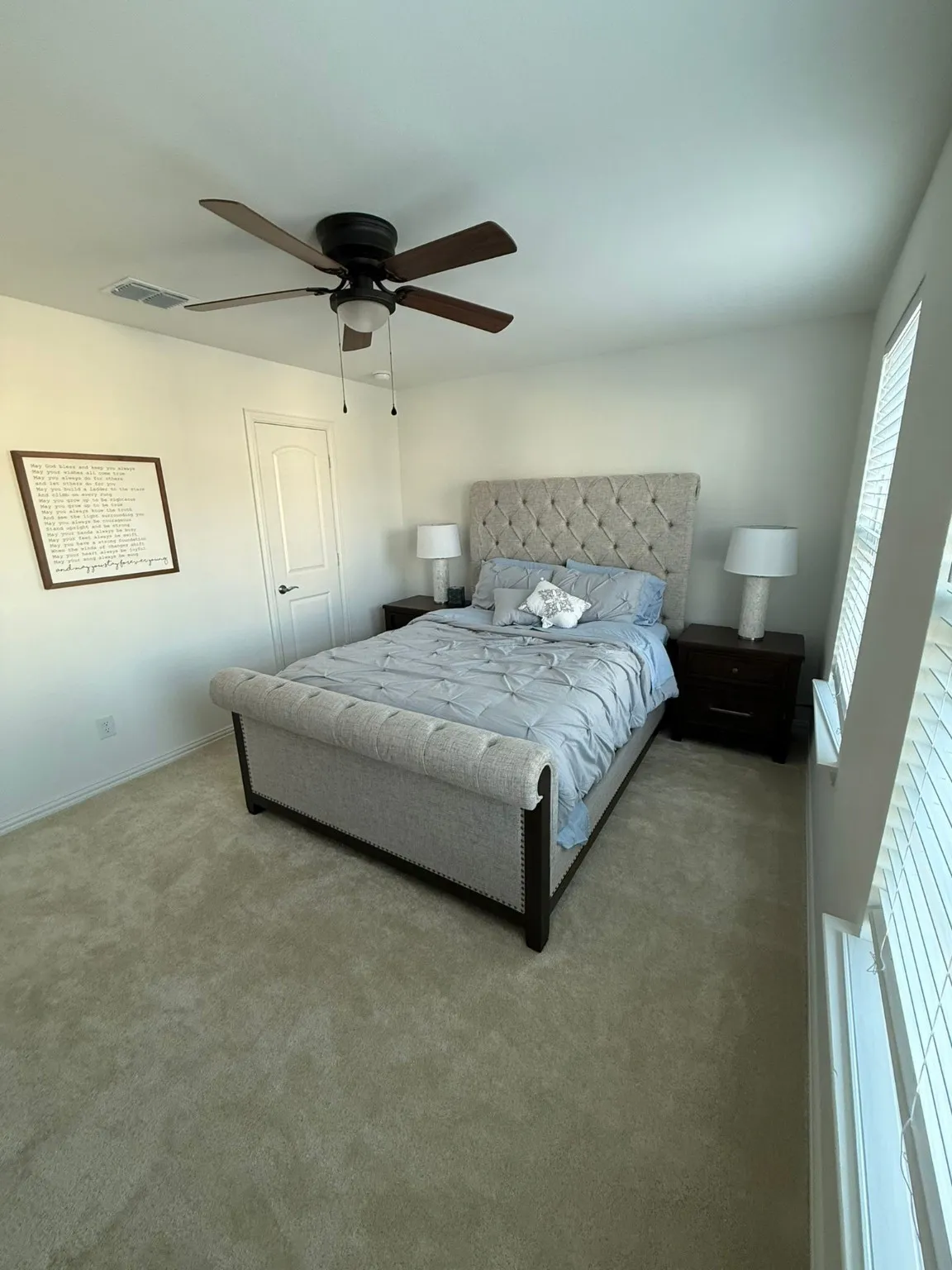 Bedroom featuring carpet and ceiling fan