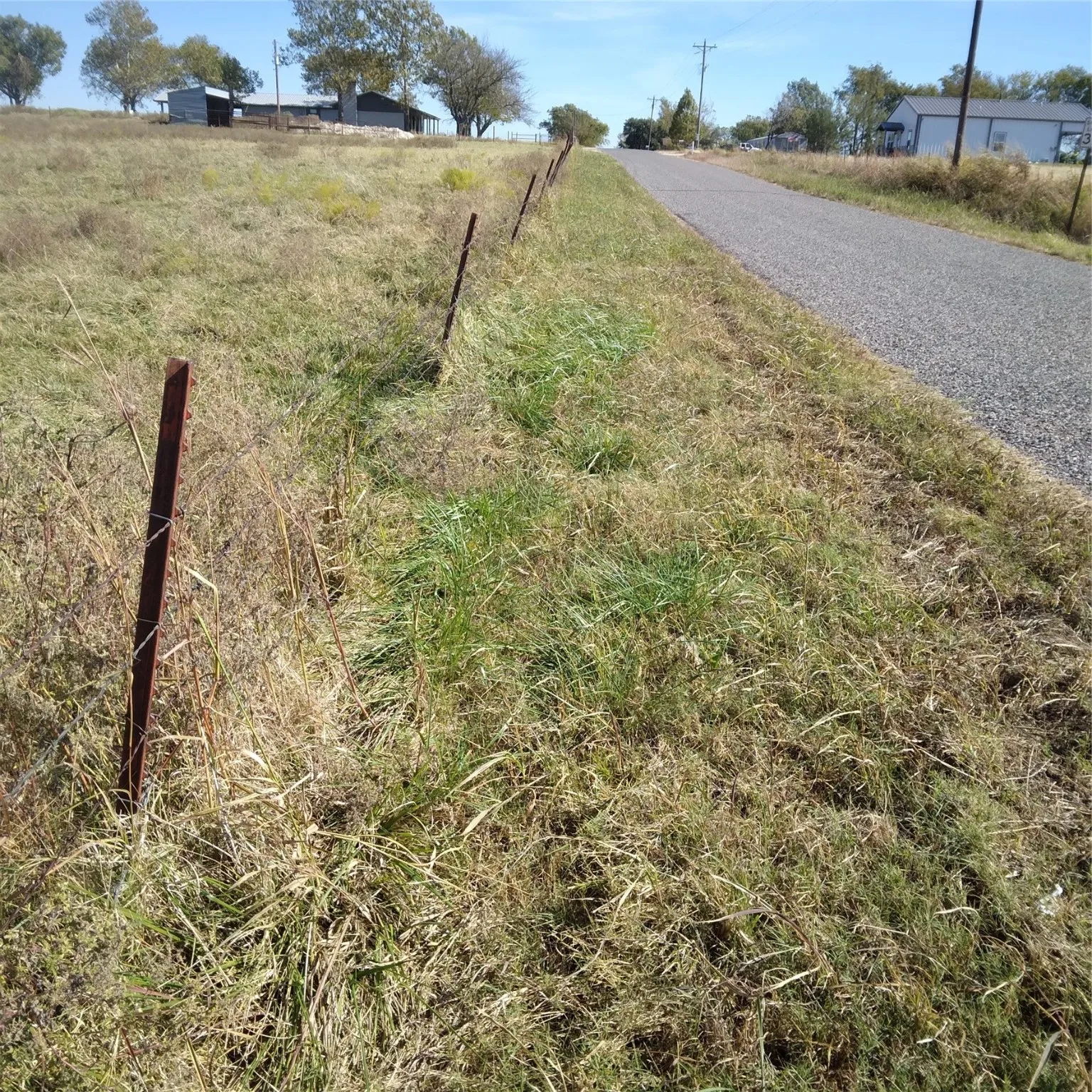 View of County Road 302, camera facing east, subject on left