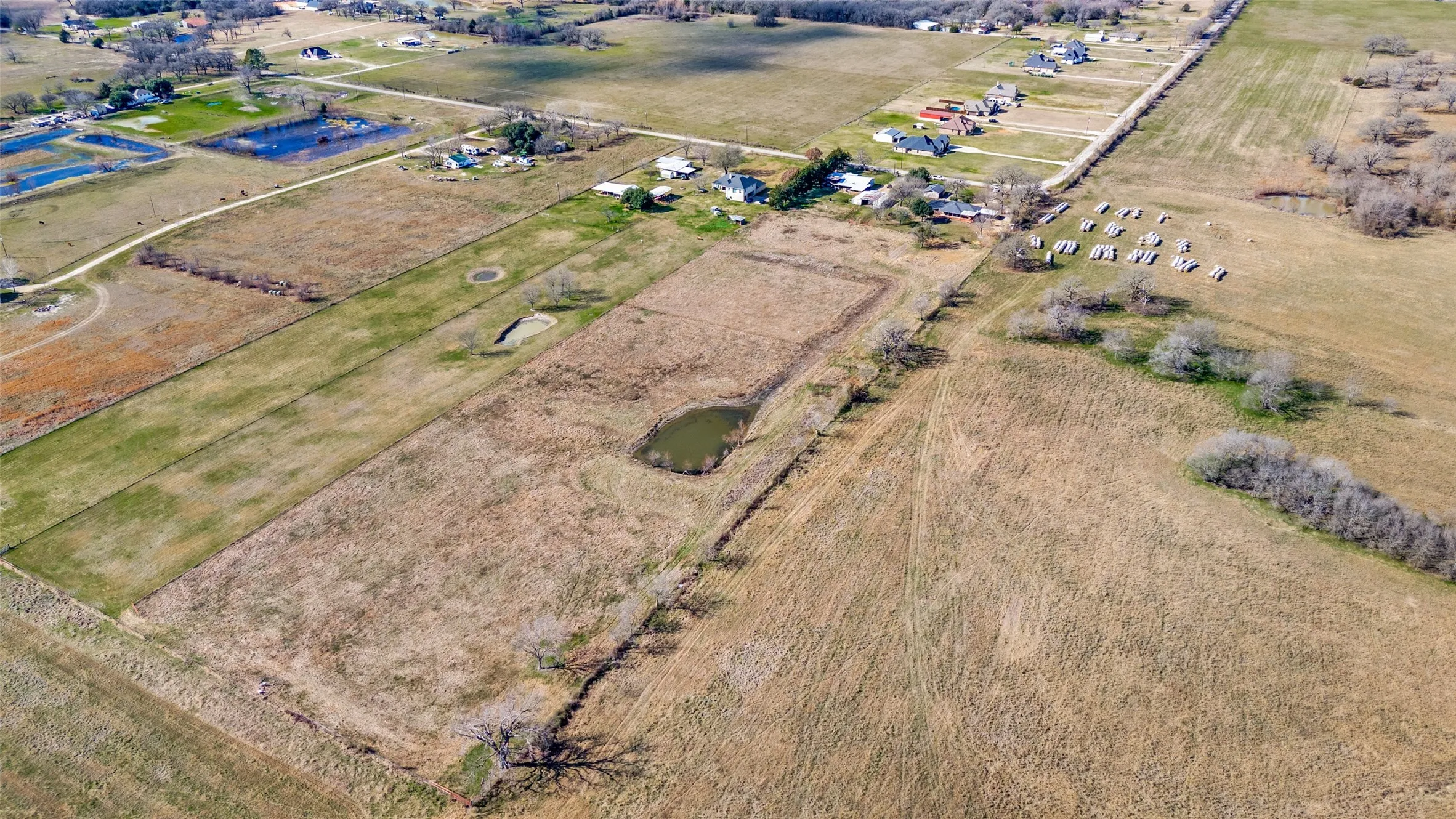 9 Acres that includes stocked pond