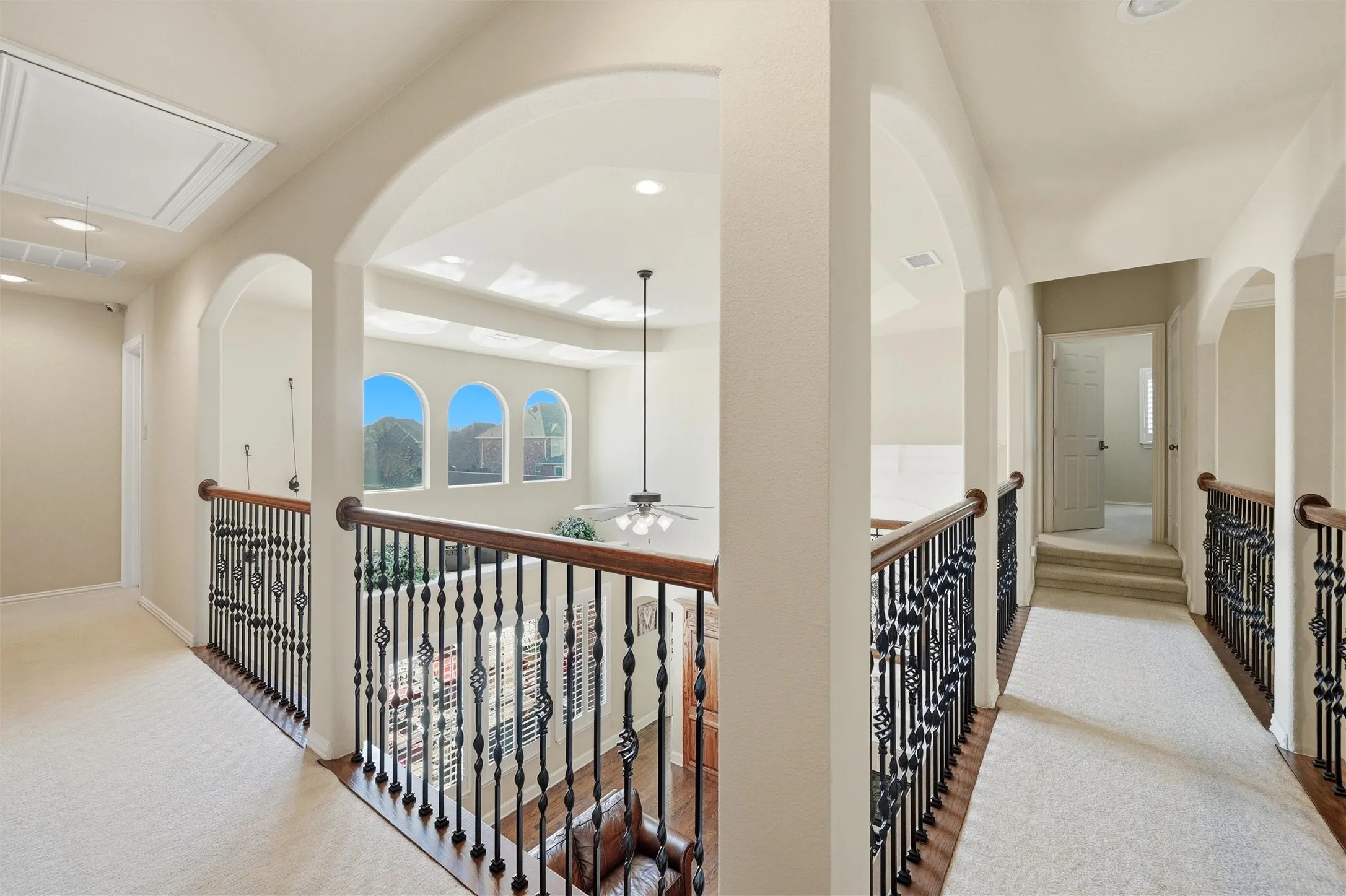 Corridor featuring attic access, carpet flooring, and recessed lighting