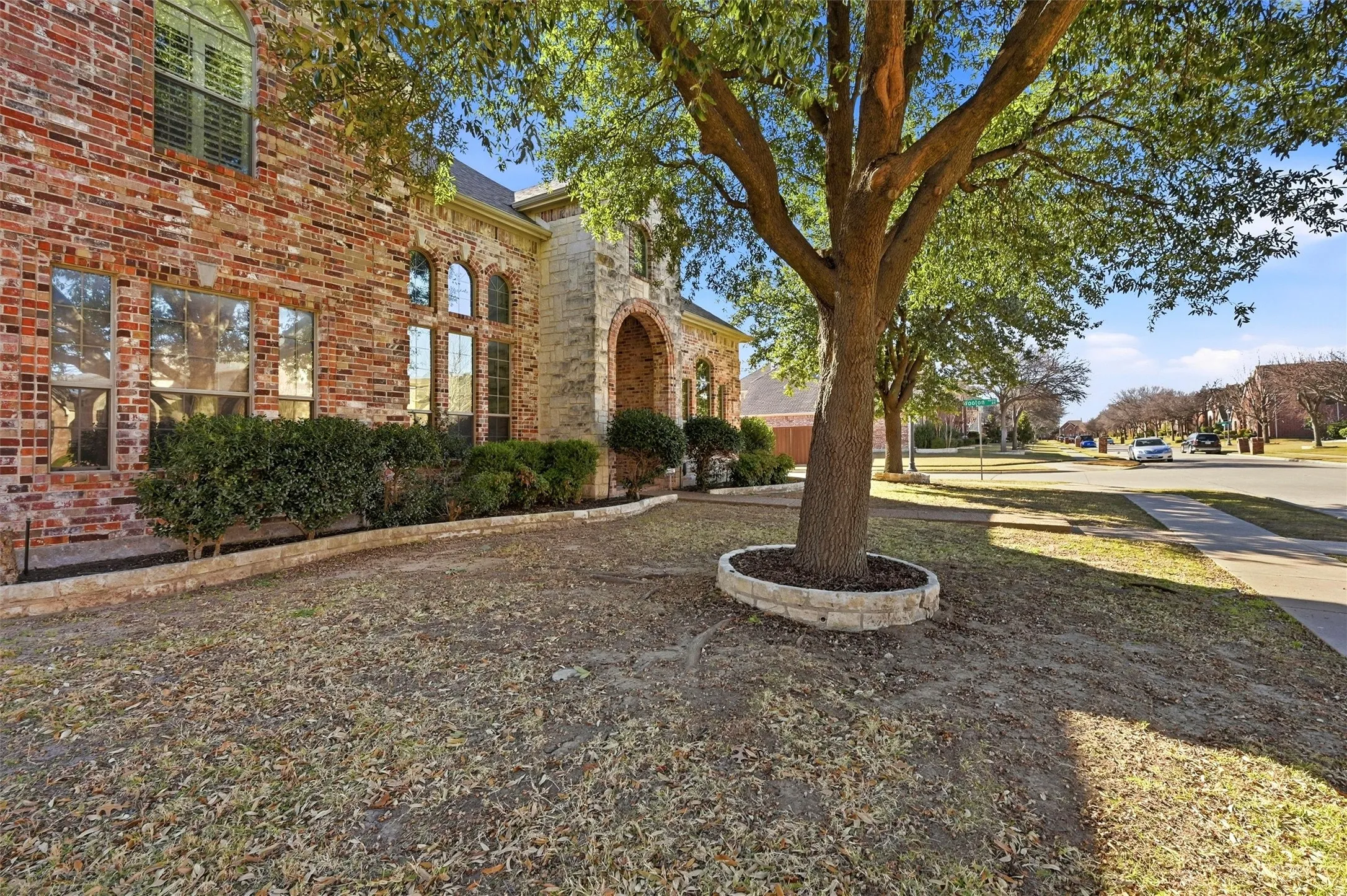 View of side of property featuring brick siding