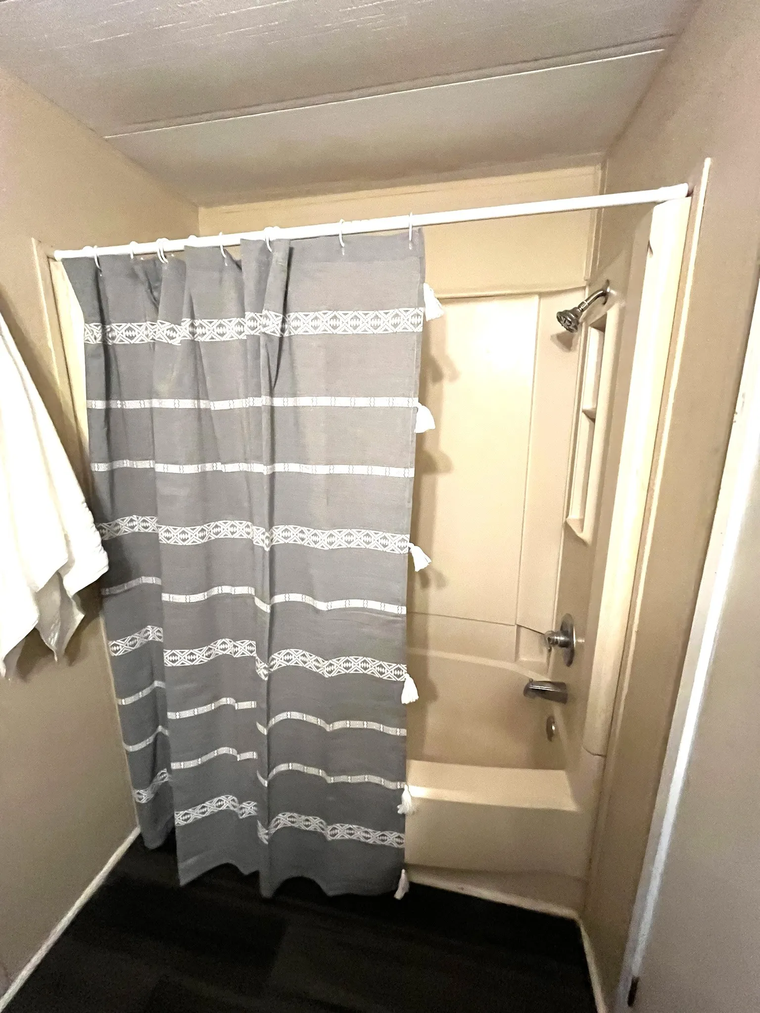 Full bath featuring shower / bath combo with shower curtain
