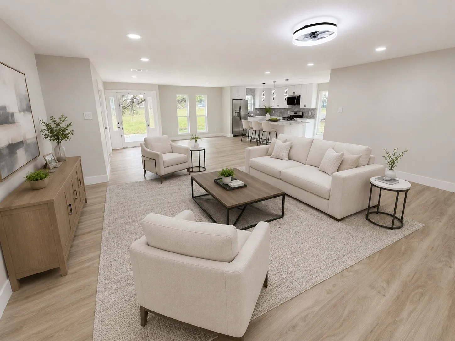 Open-concept living area featuring wood-finish flooring, recessed lighting, and a modern ceiling fan
