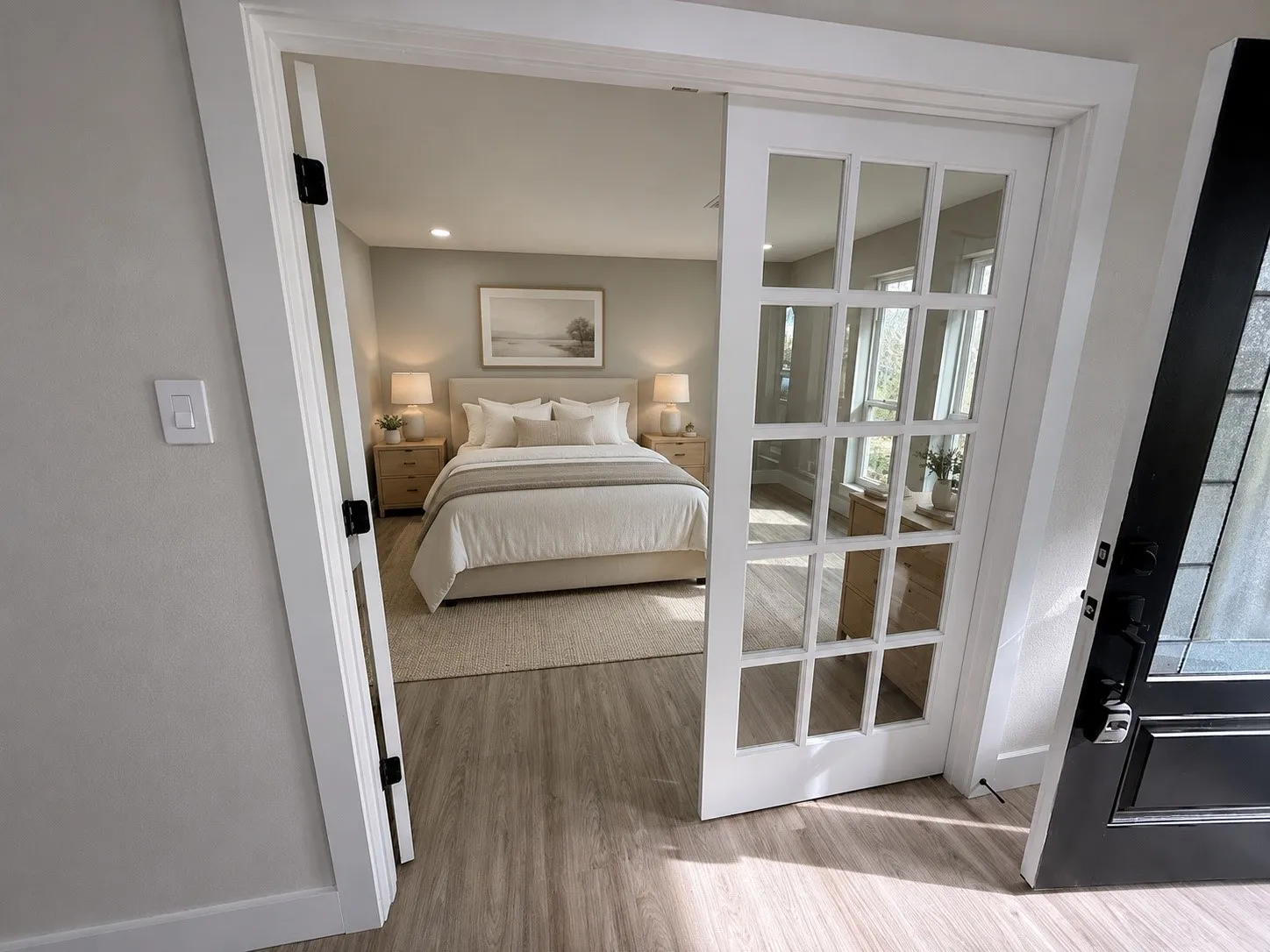 Bedroom featuring light wood-finish flooring, recessed lighting, and ample natural light from multiple windows