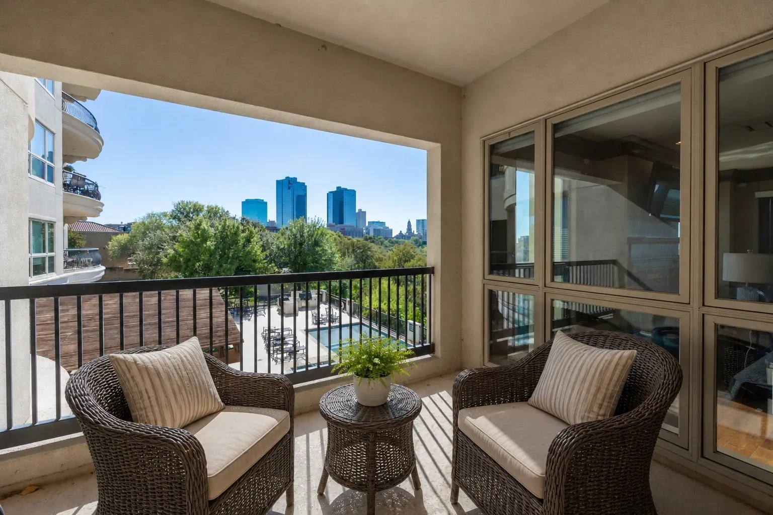 AI staged.  Balcony has beautiful city and river views.