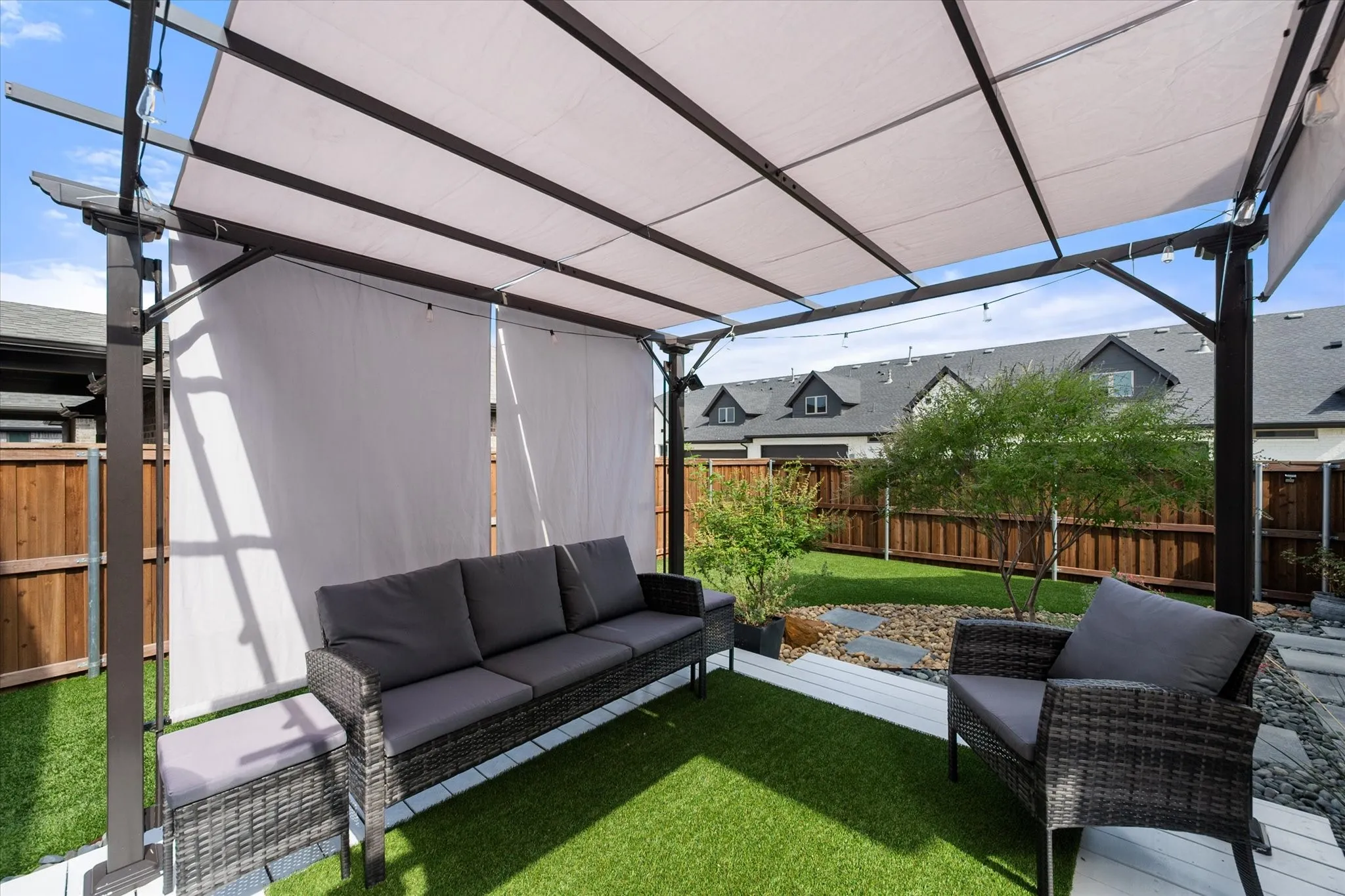 Fenced backyard featuring an outdoor living space