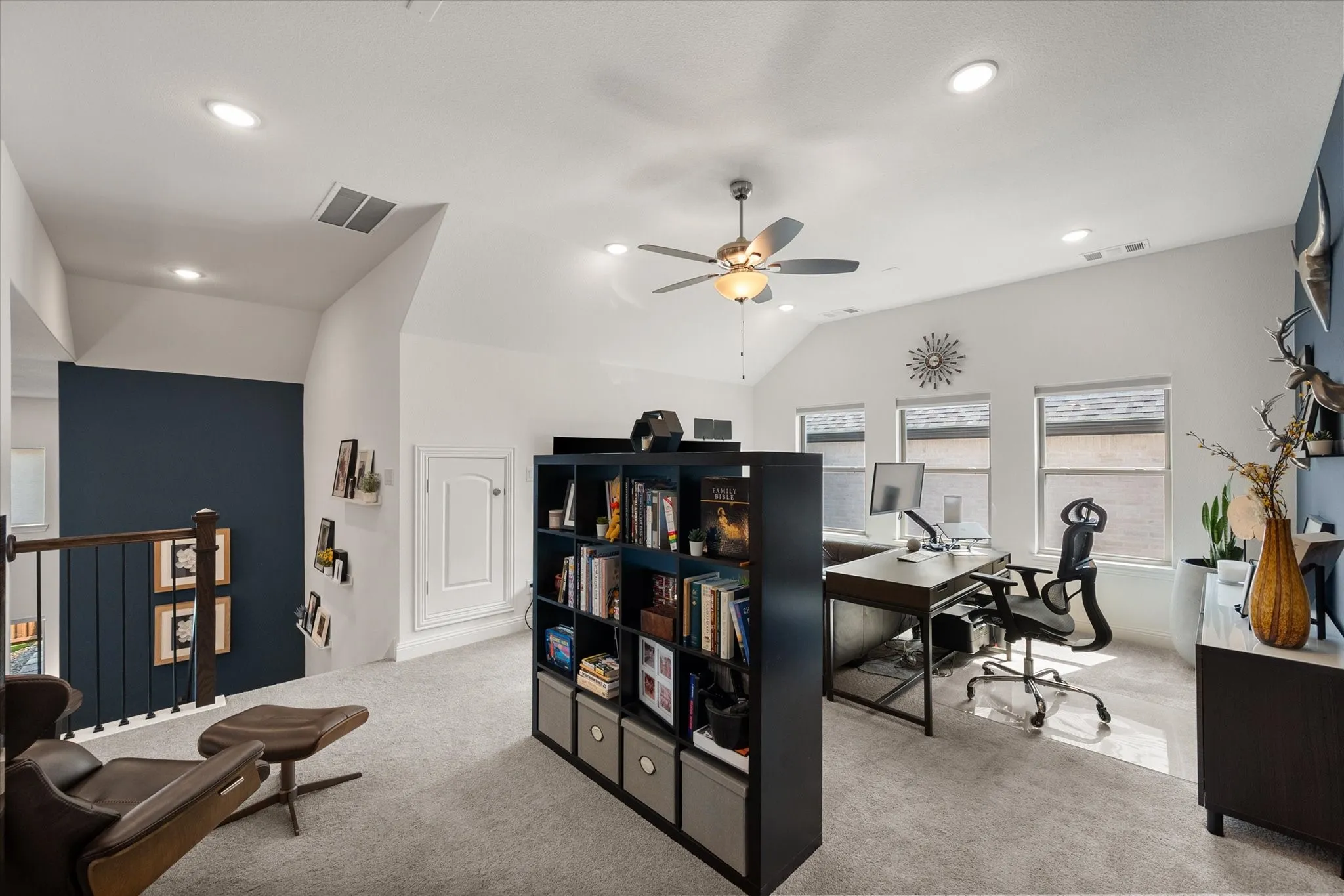 Gameroom or Office space with vaulted ceiling, light colored carpet, recessed lighting, and a ceiling fan