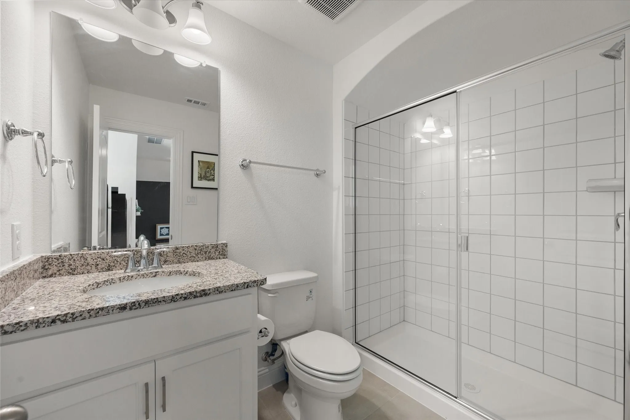 Gameroom with Full bathroom upstairs  with a shower stall and vanity