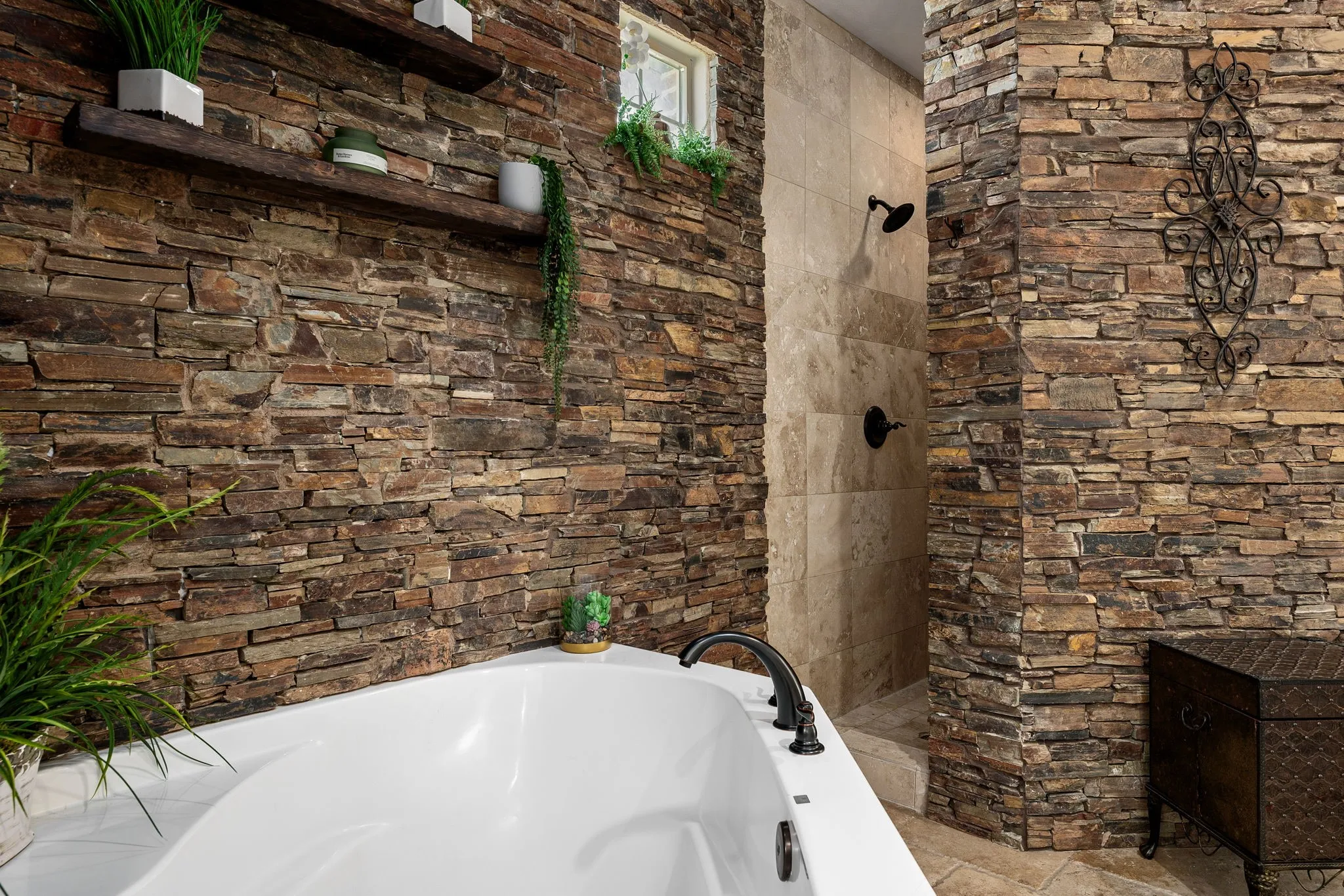 Full bath featuring a bath and walk in shower