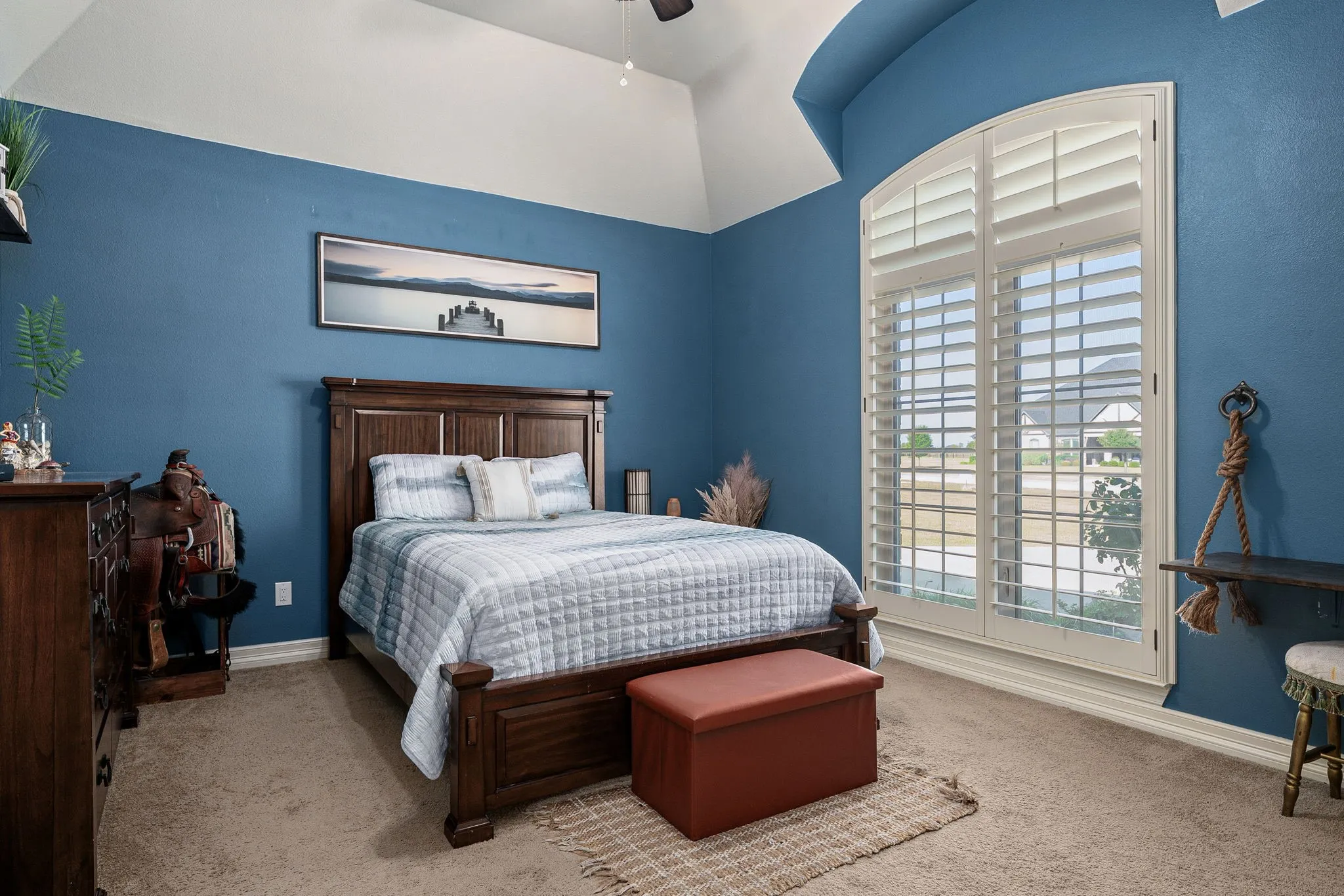 Bedroom featuring carpet and ceiling fan