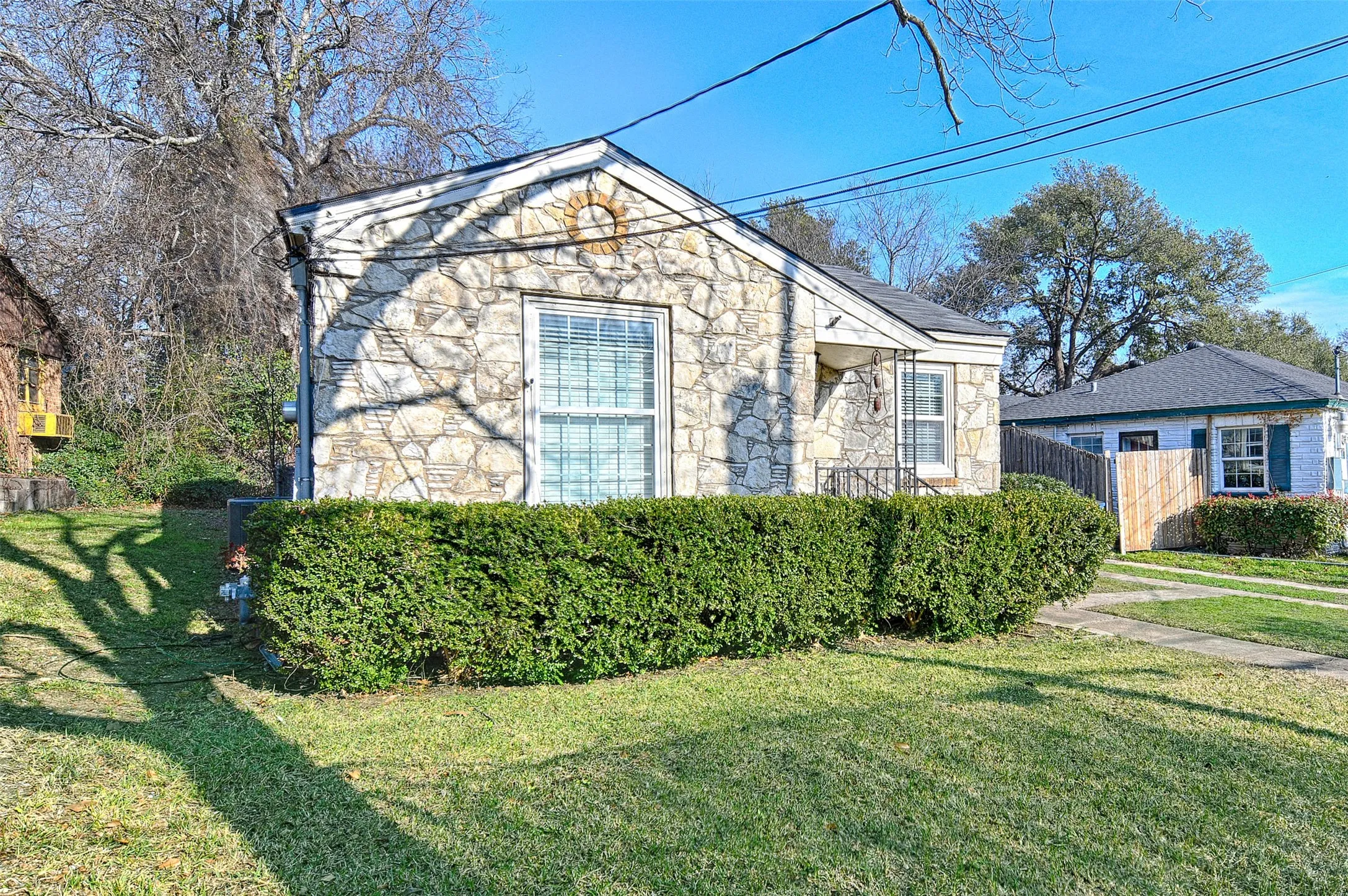 View of front facade featuring stone siding