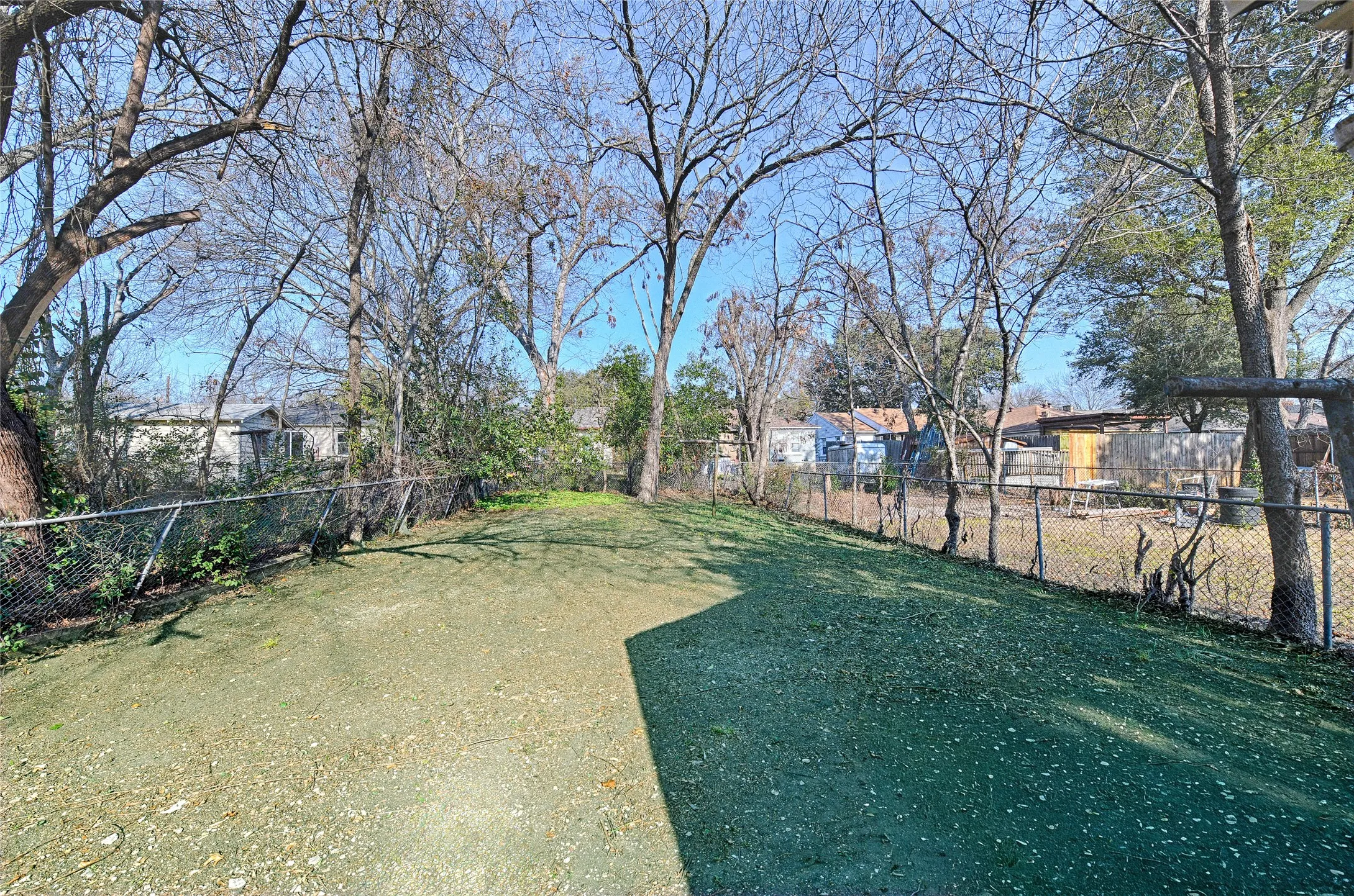 View of fenced backyard