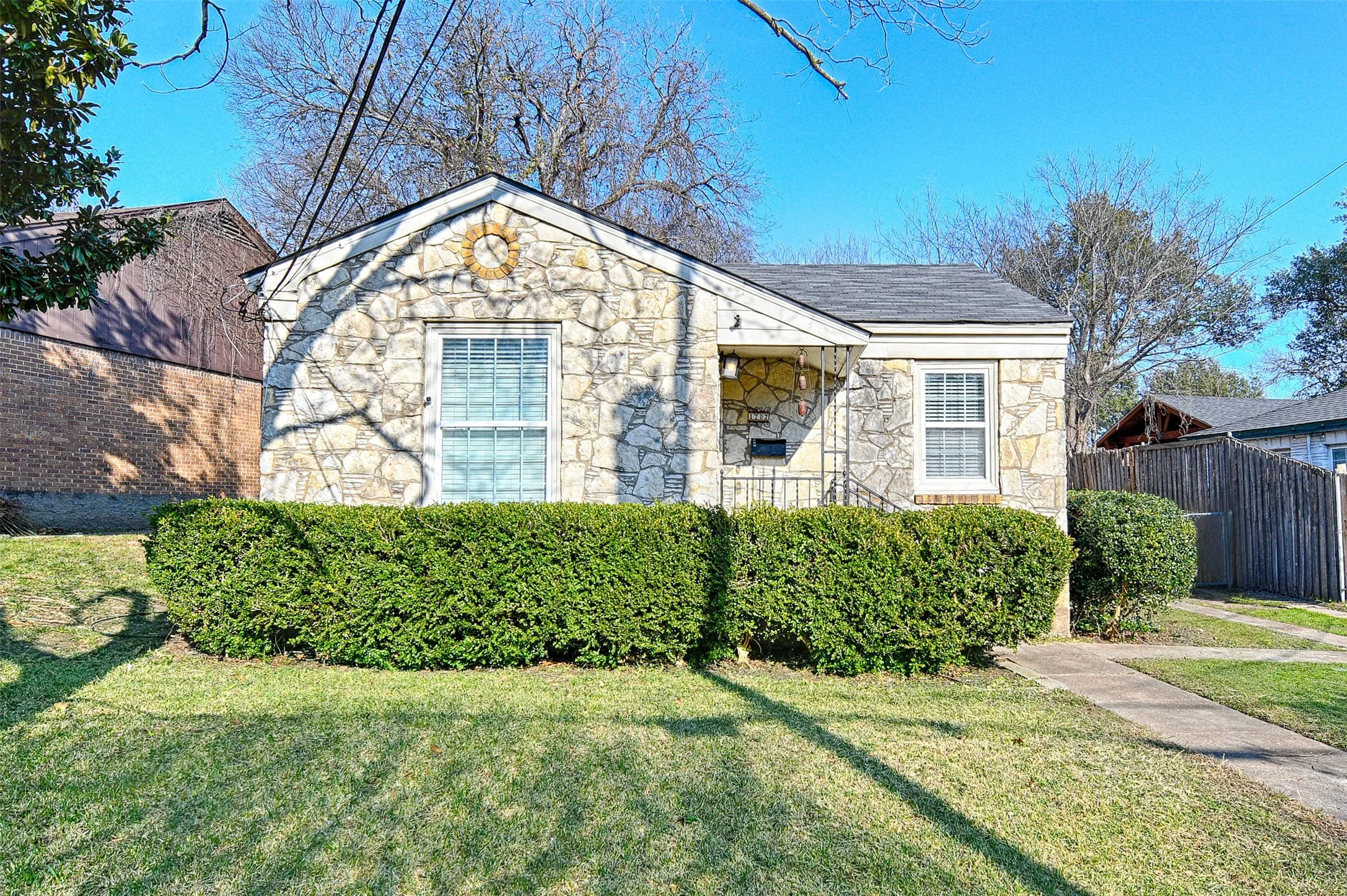 Bungalow-style house featuring stone siding