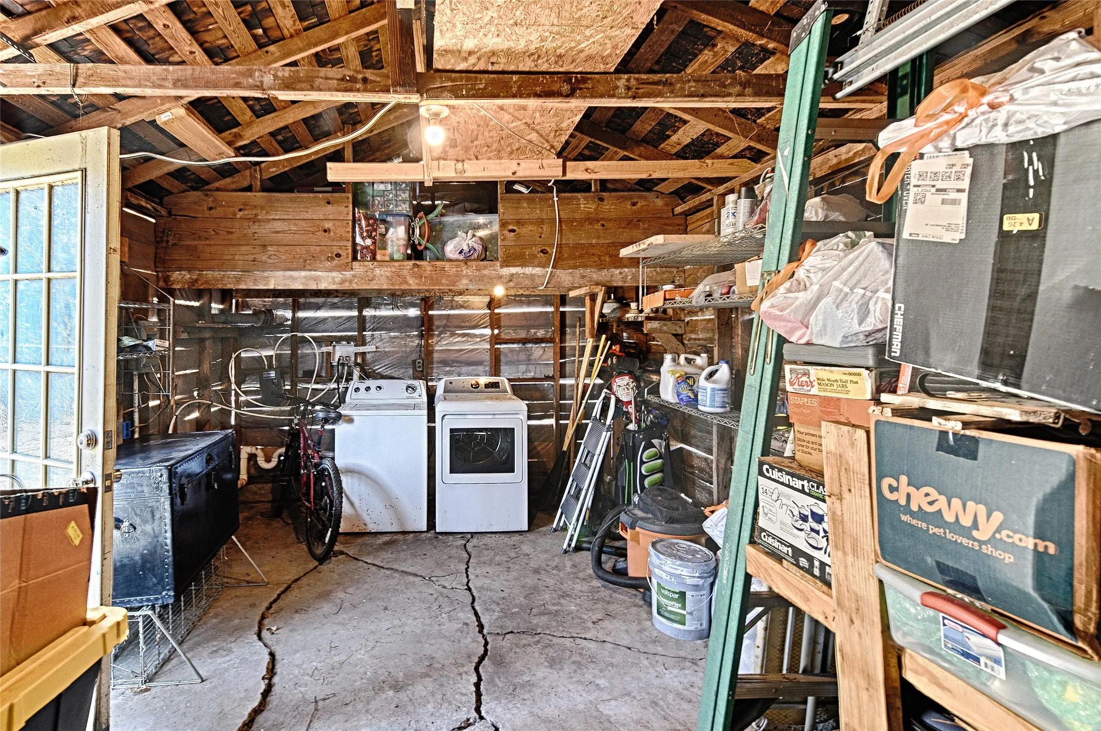 Inside of garage with washer and dryer hook ups