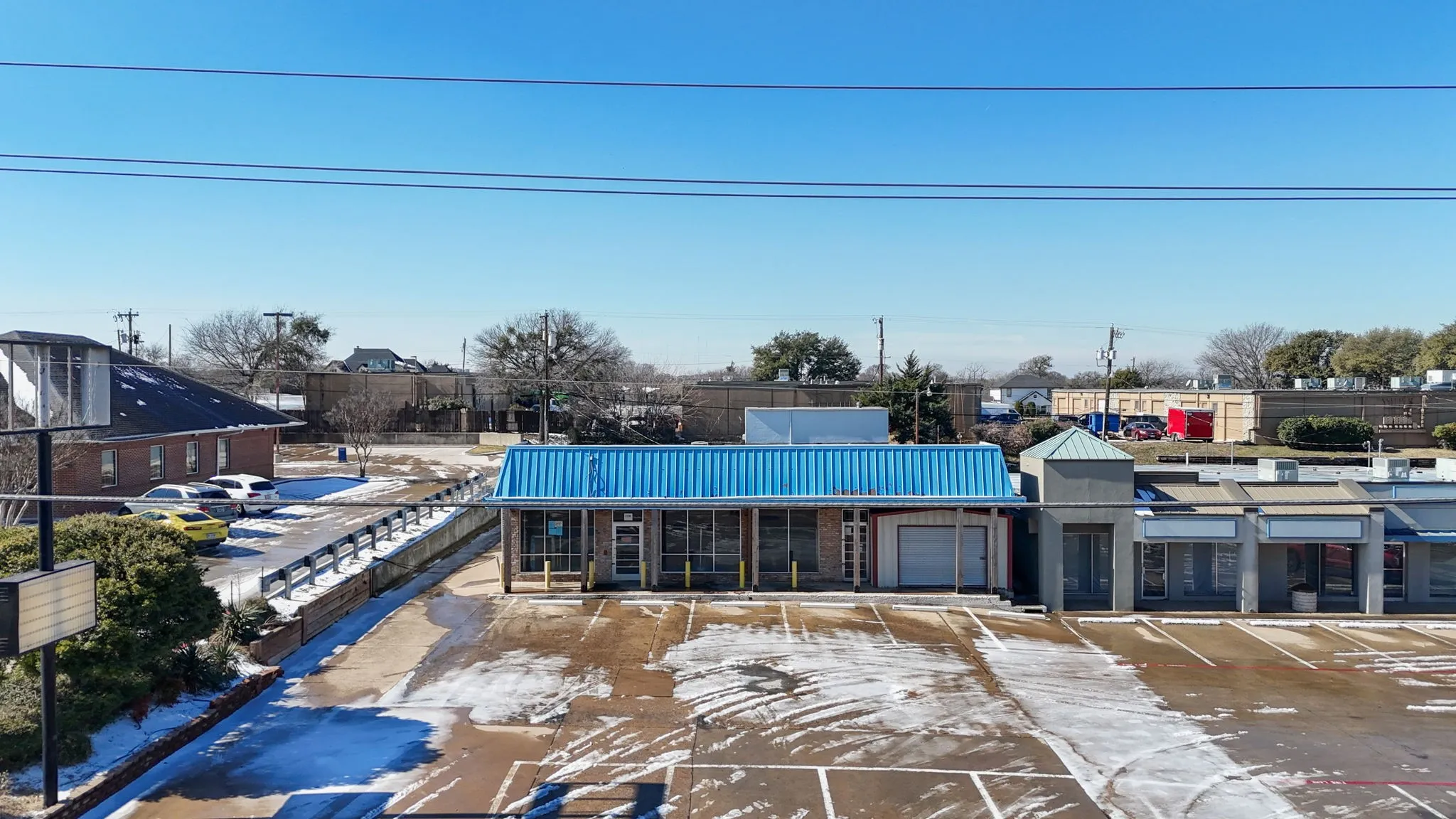 Aerial: 0.4 acres with parking front and rear