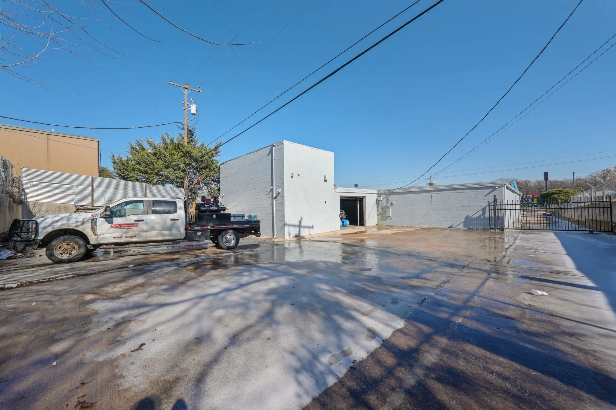 Paved lot along the side of the building