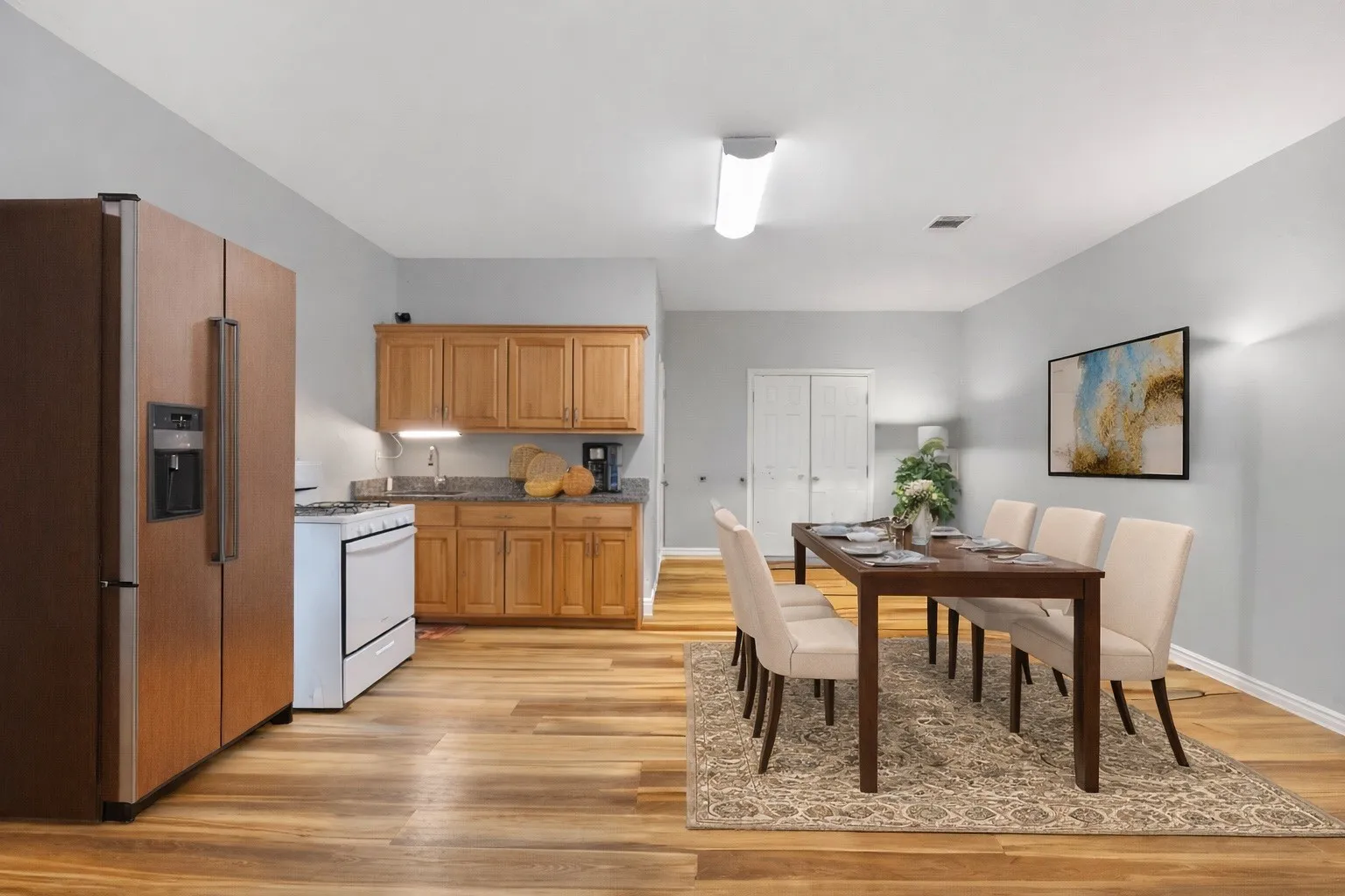 Vitually Staged- Flex space to be used as a break room, meeting room, dining room, multi-use with exterior access.