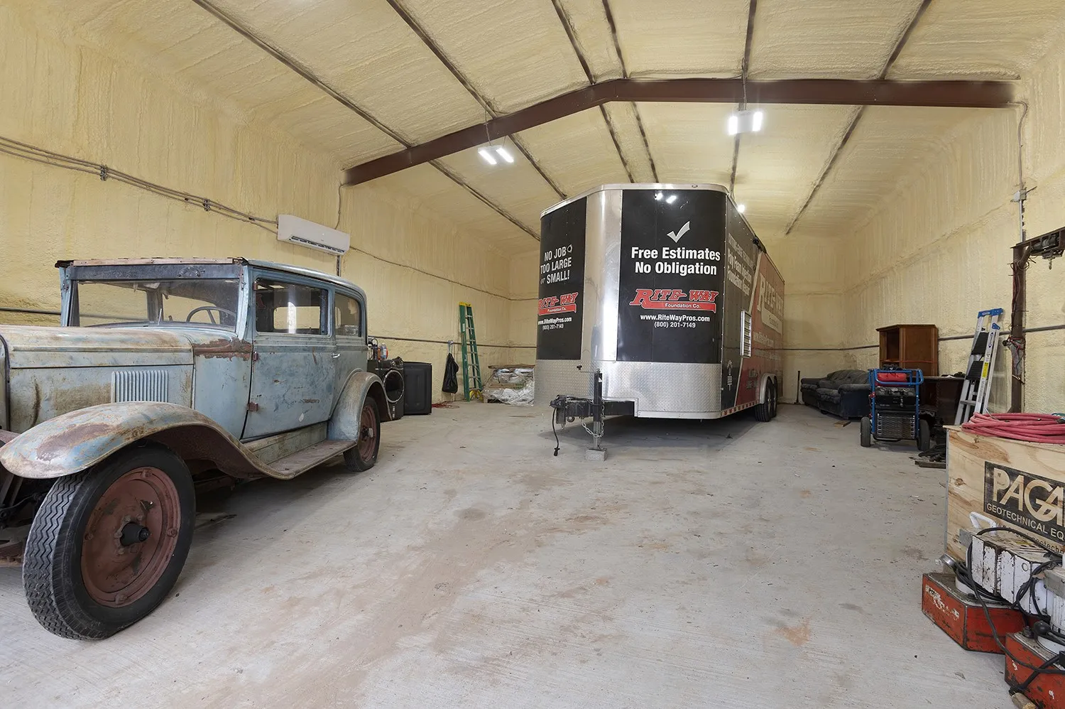Garage featuring a wall mounted A/C, heat