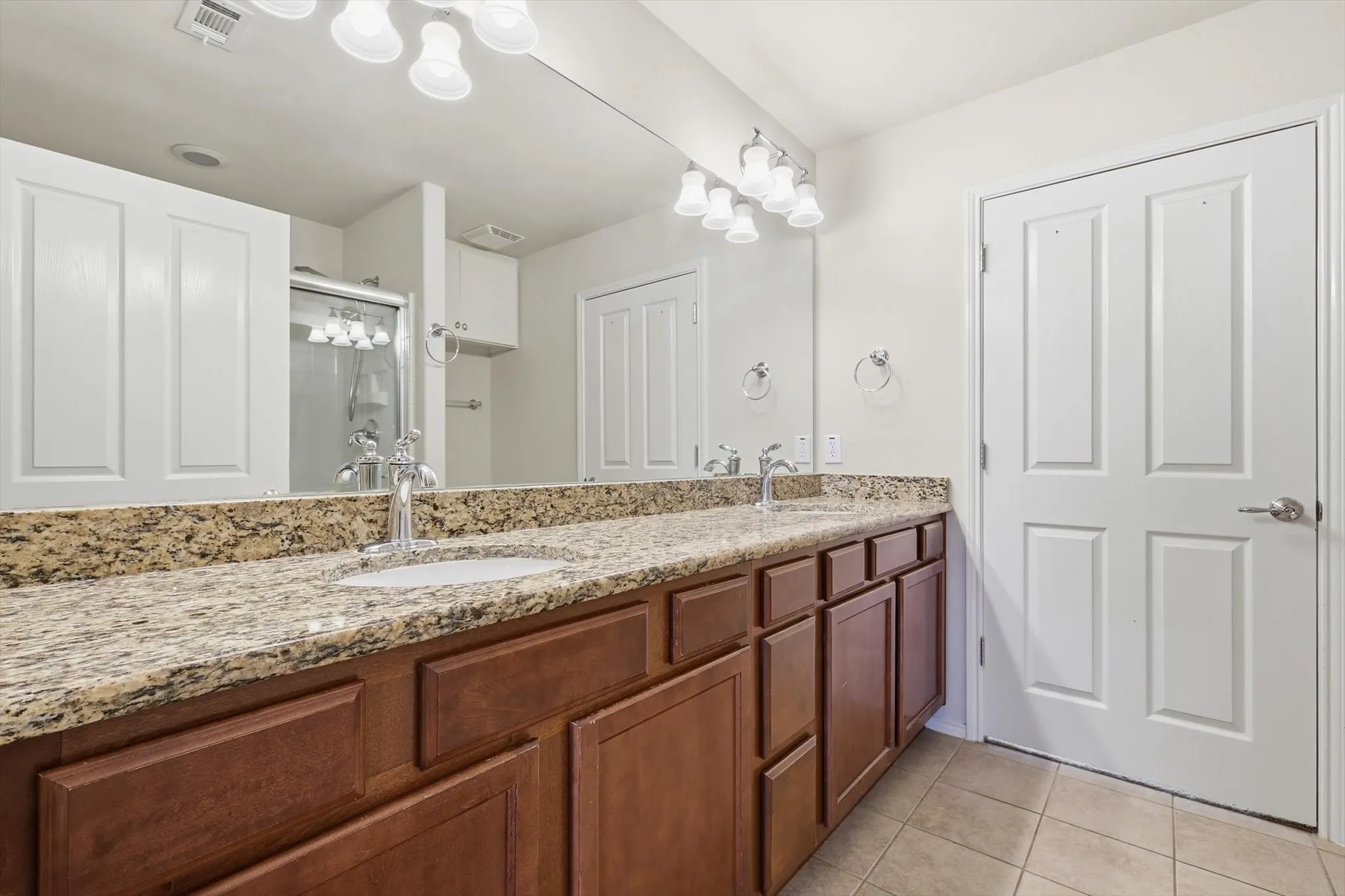 Primary Bathroom with dual sinks and Walk In Closet
