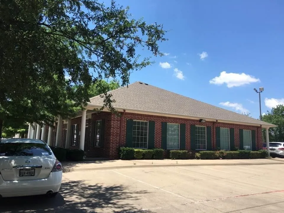 Parking in front, side and back of office building.