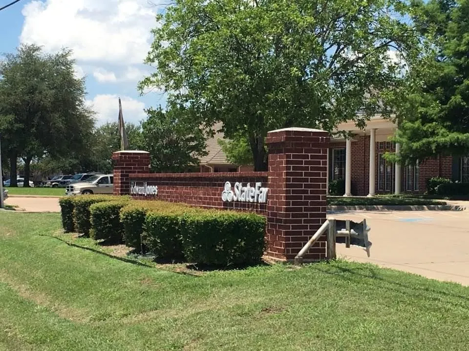 Monument signage in front of office building.