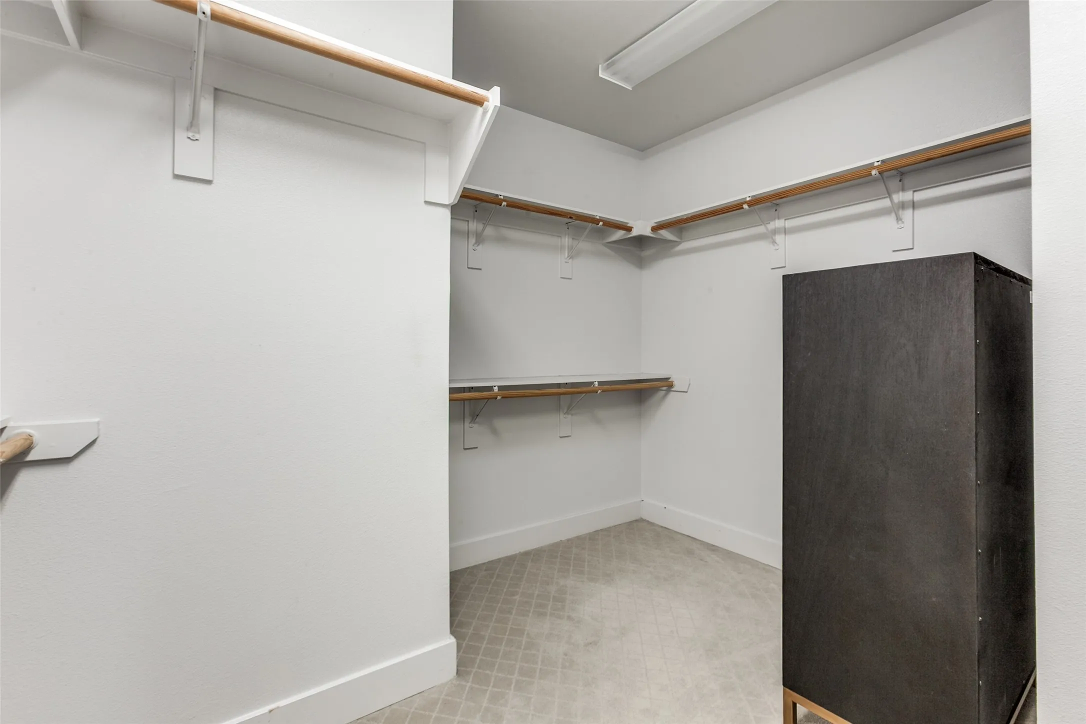Large walk in closet in primary bedroom/bath