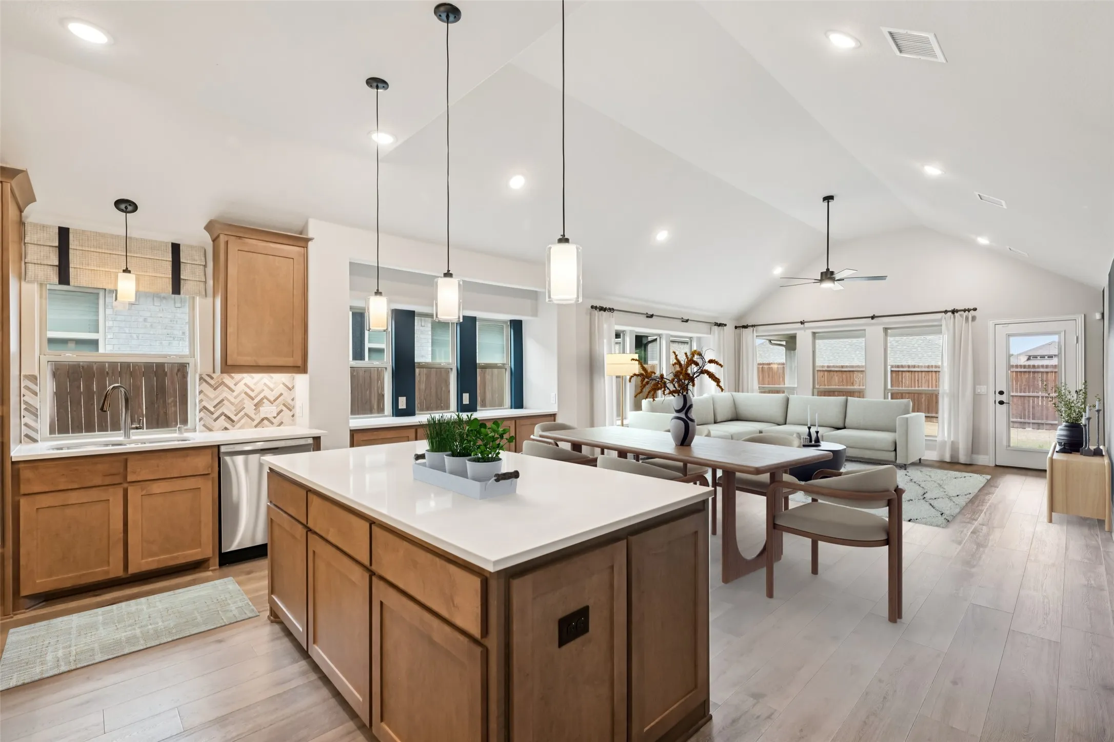 Open concept kitchen and living room - digitally staged