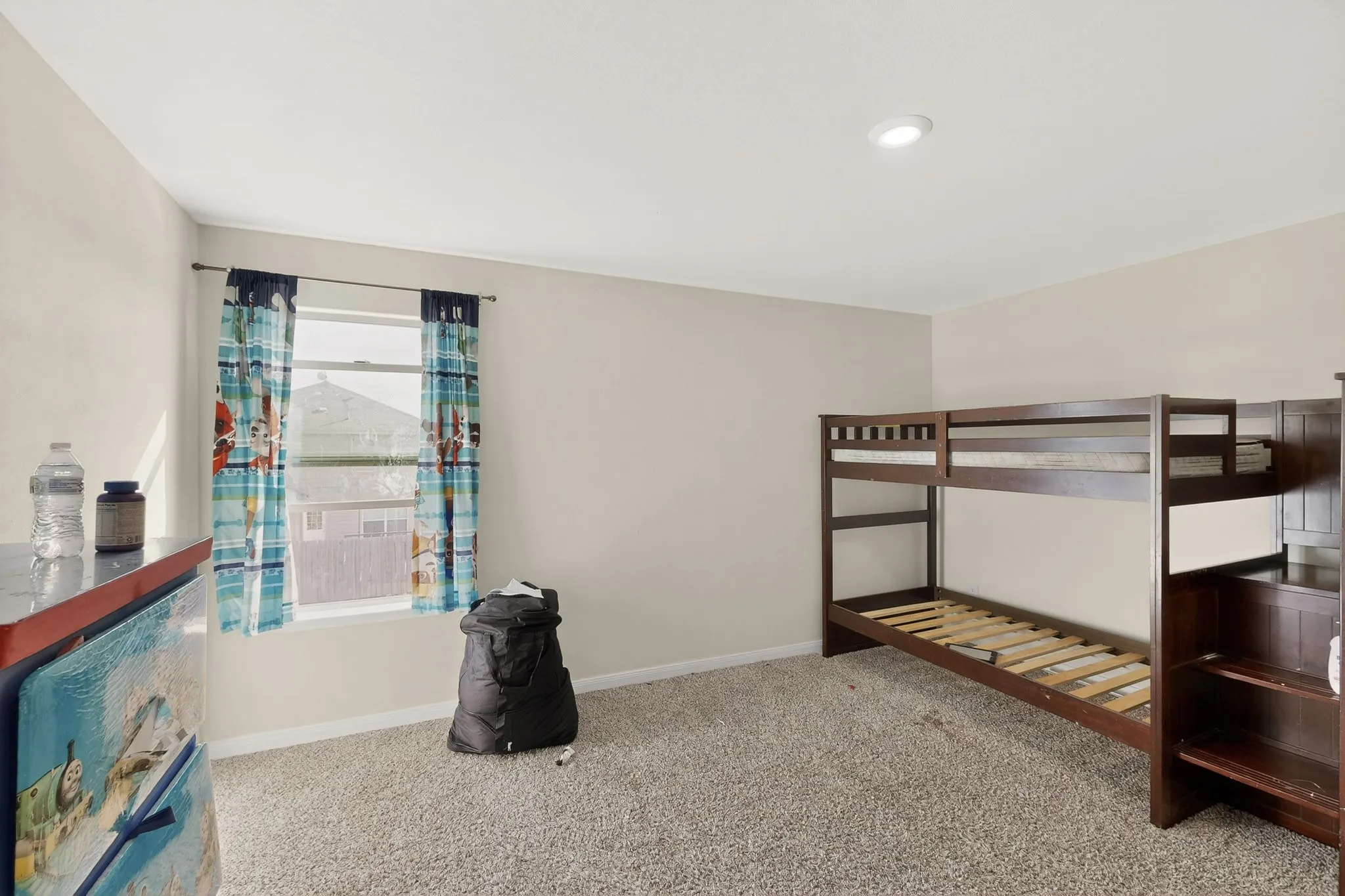 Unfurnished bedroom with baseboards and carpet floors