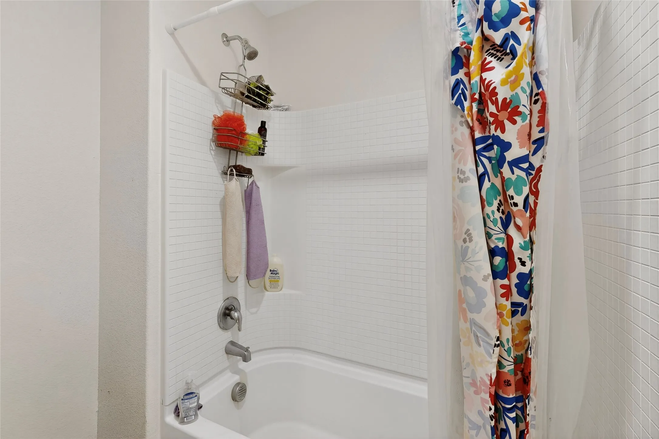 Bathroom with shower / tub combo with curtain