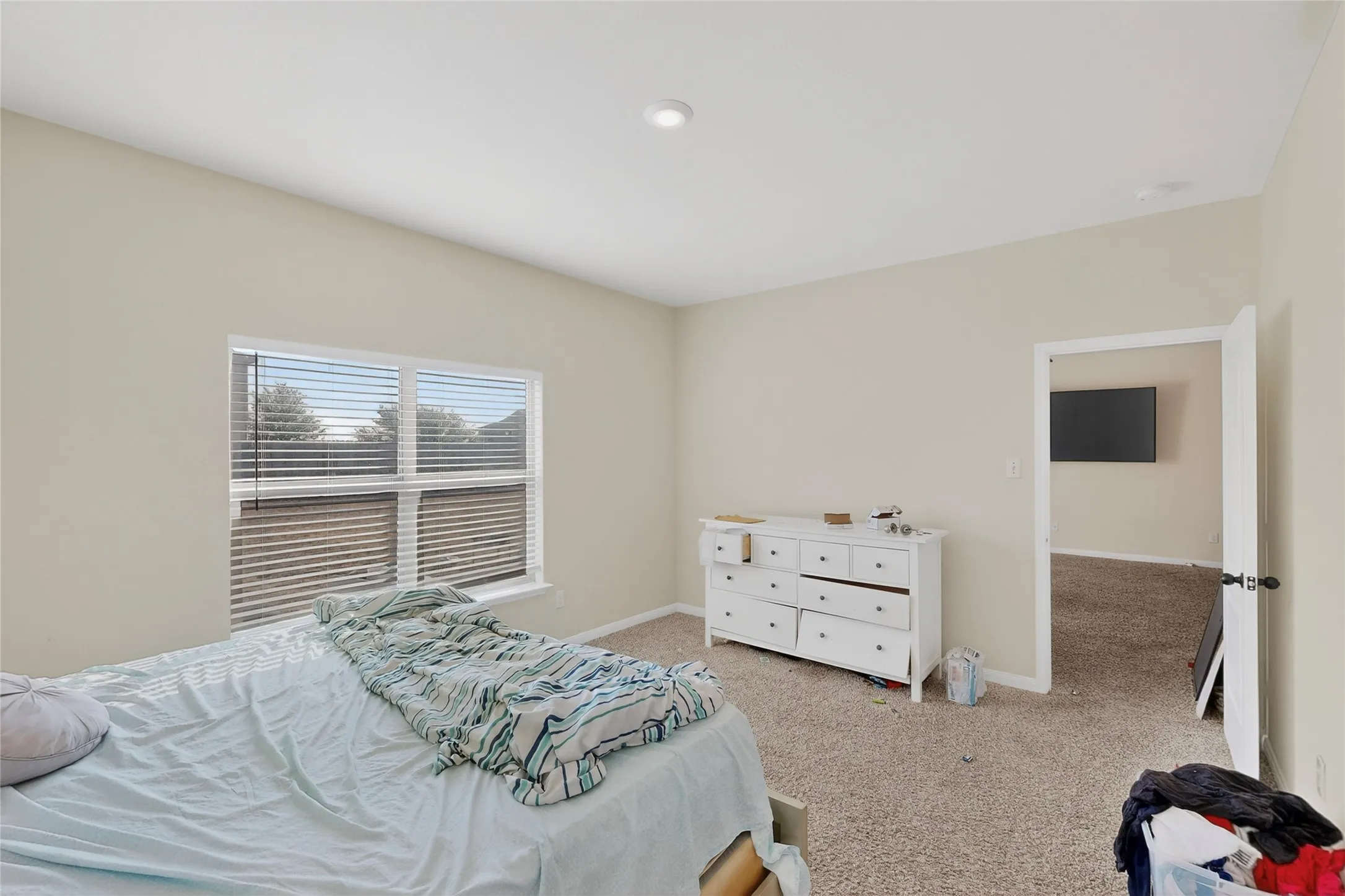 Bedroom with baseboards and carpet floors