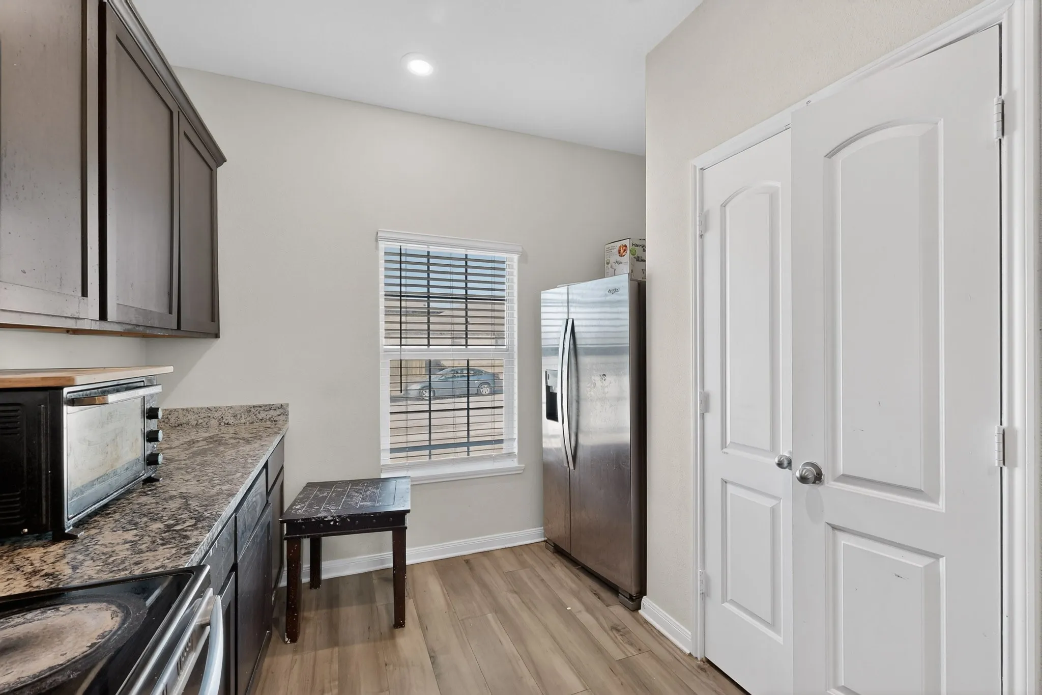 Kitchen featuring stainless steel appliances and light wood finished floors