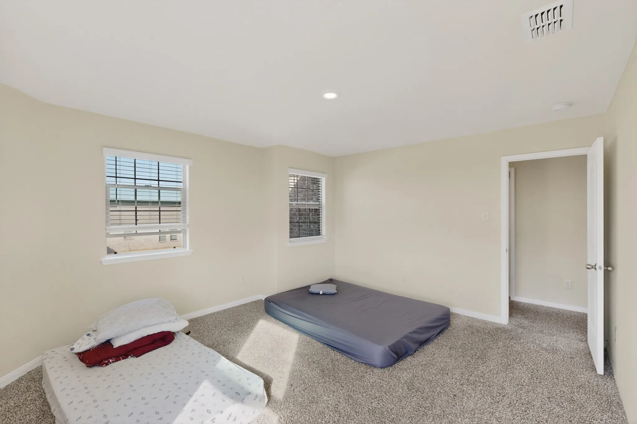 Unfurnished bedroom featuring carpet floors and recessed lighting