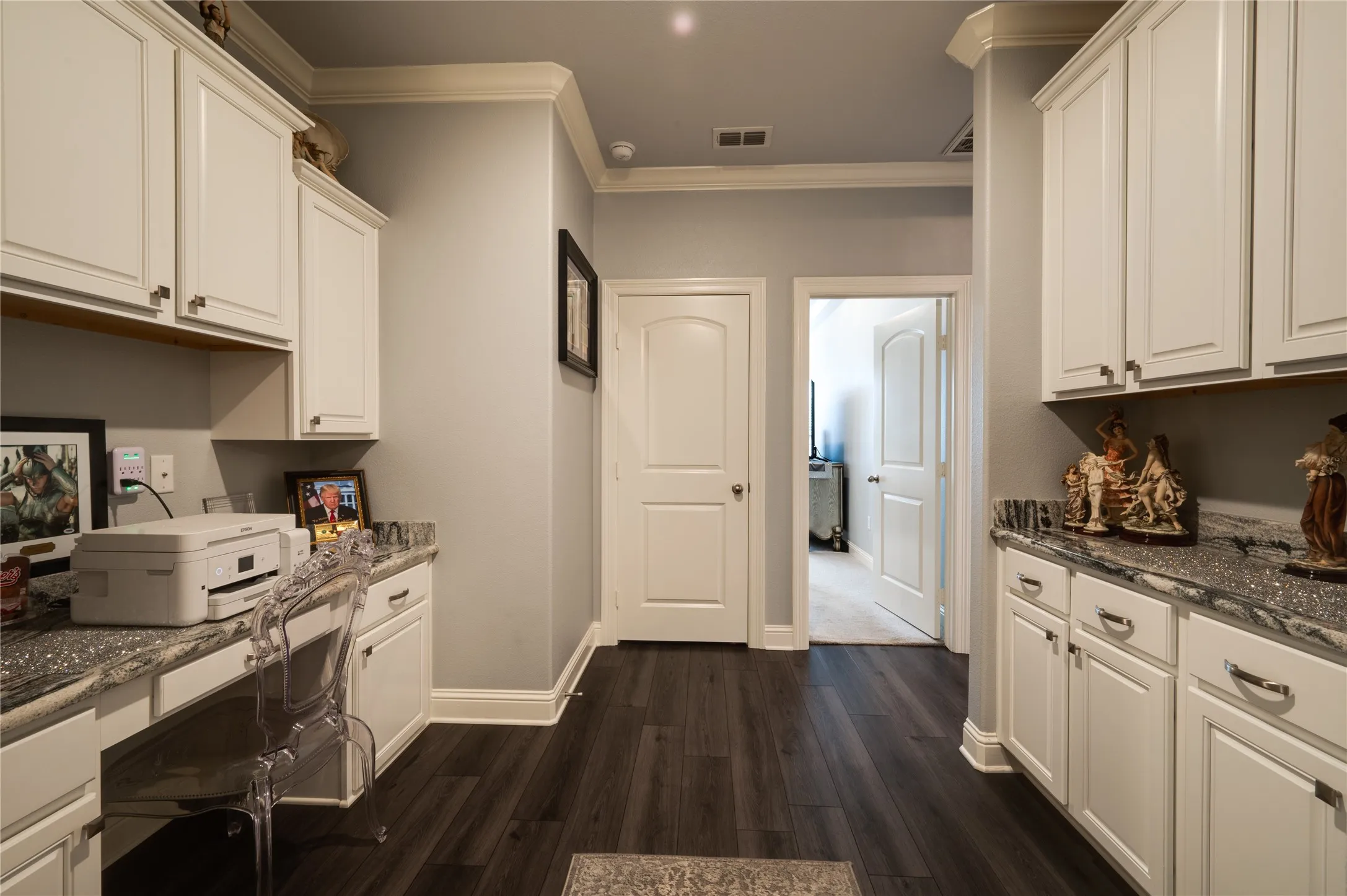 Office with built in cabinetry and desk.