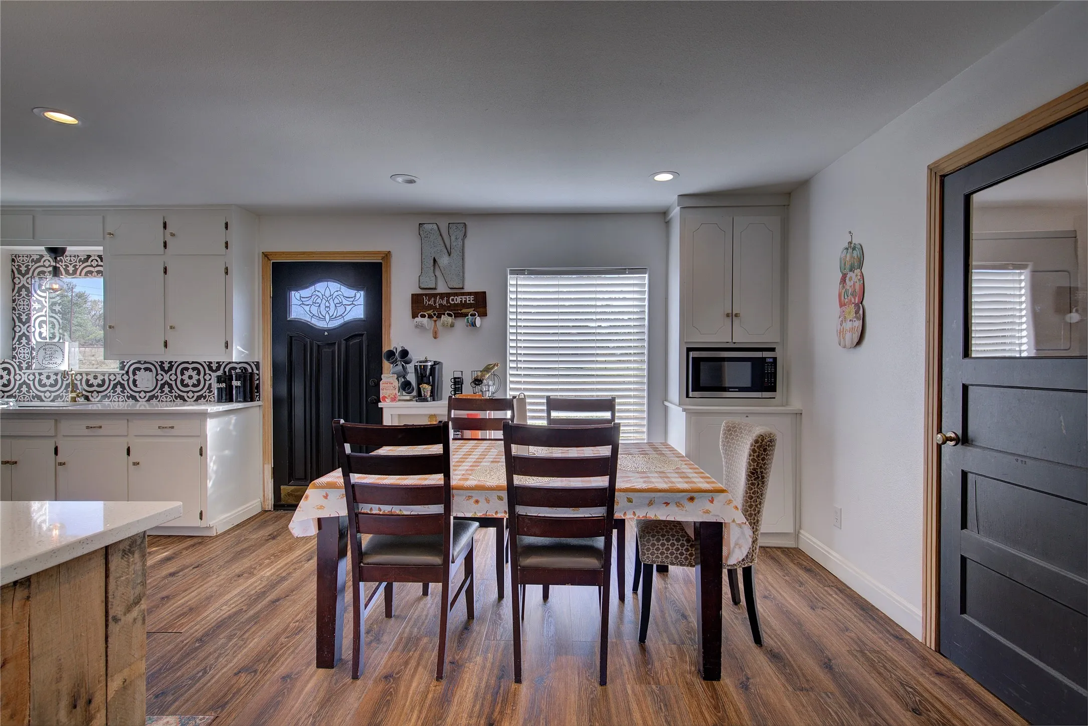 Dining area has built-in cabinet.