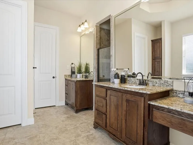 Master bathroom with two separate vanities and make up area