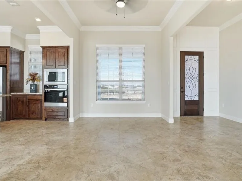 Stepping into open concept living, dining and kitchen area
