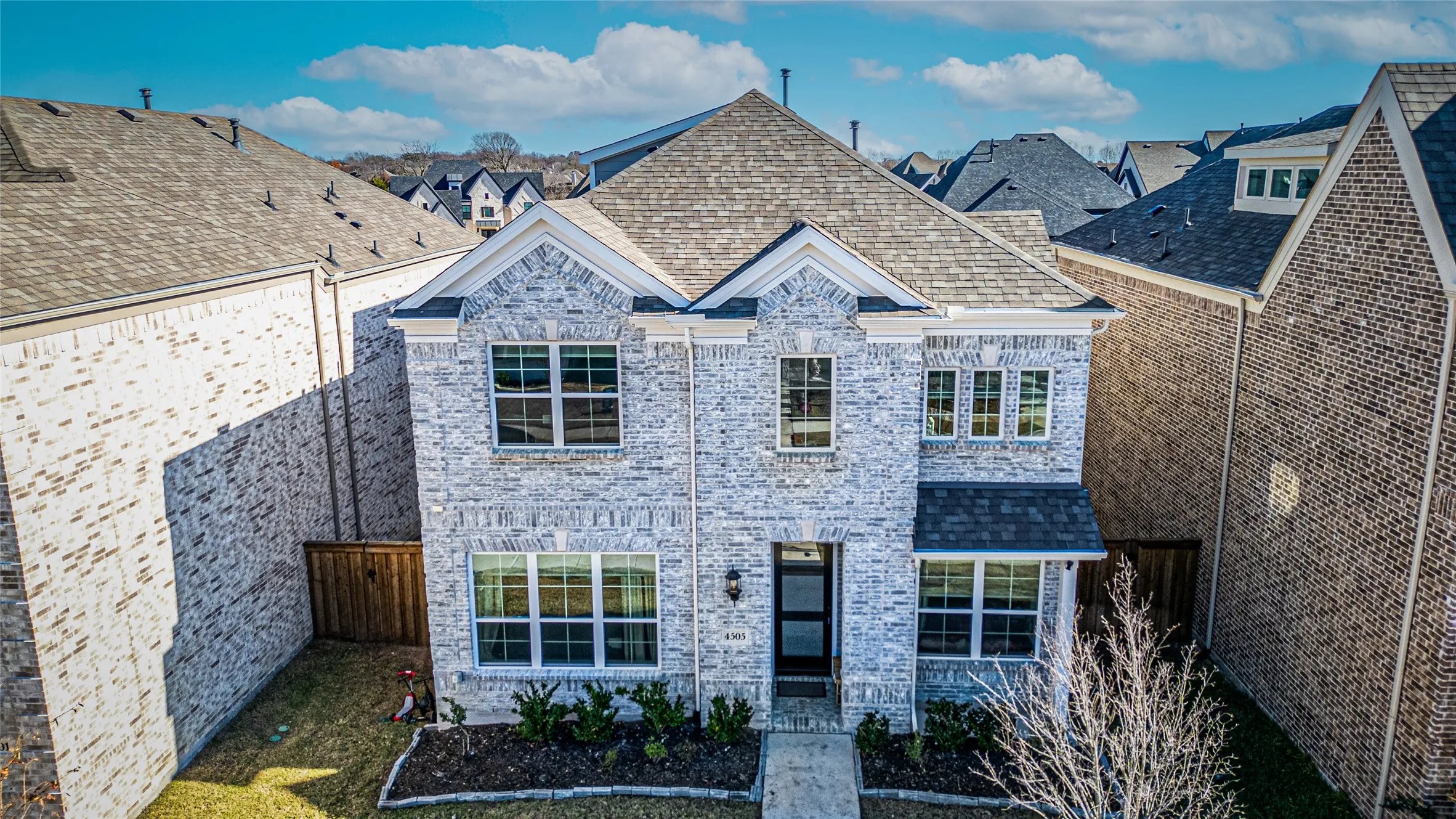 View of front of house featuring brick siding