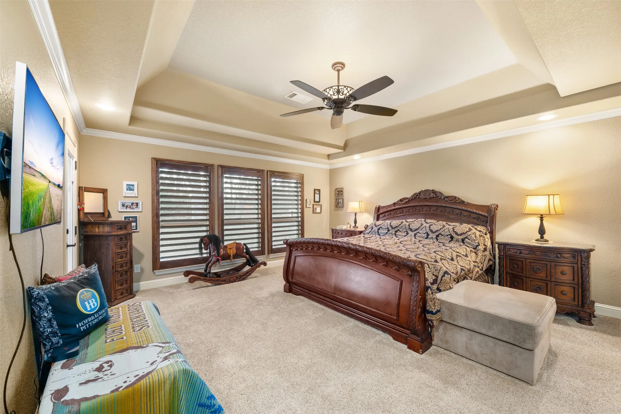 Primary bedroom w/ tray ceilings