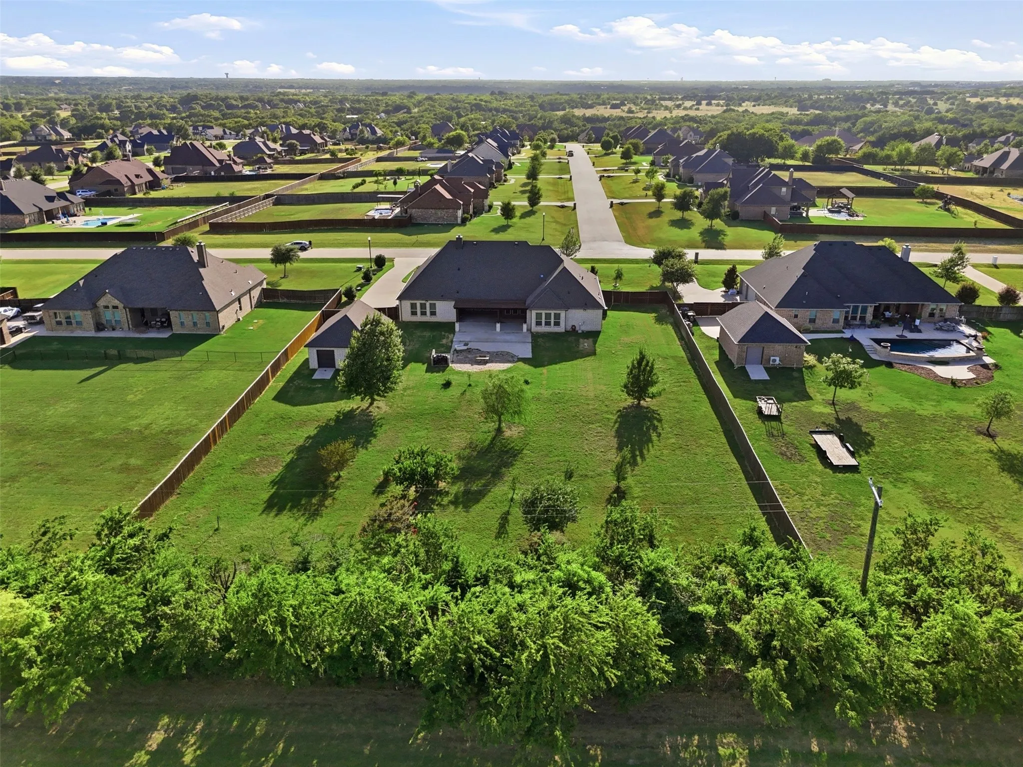 Mature tree line for privacy in the back of the lot