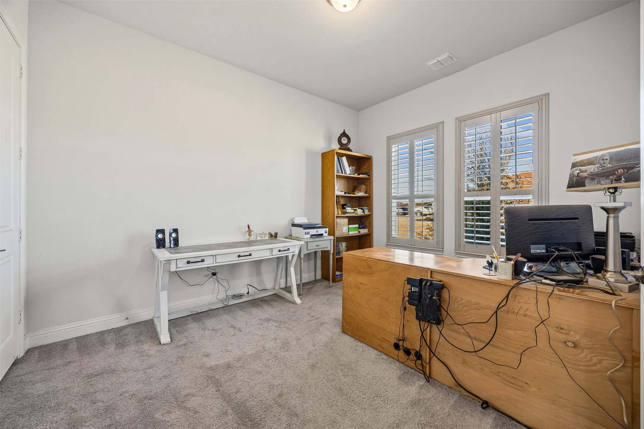 Office has closet with shelves