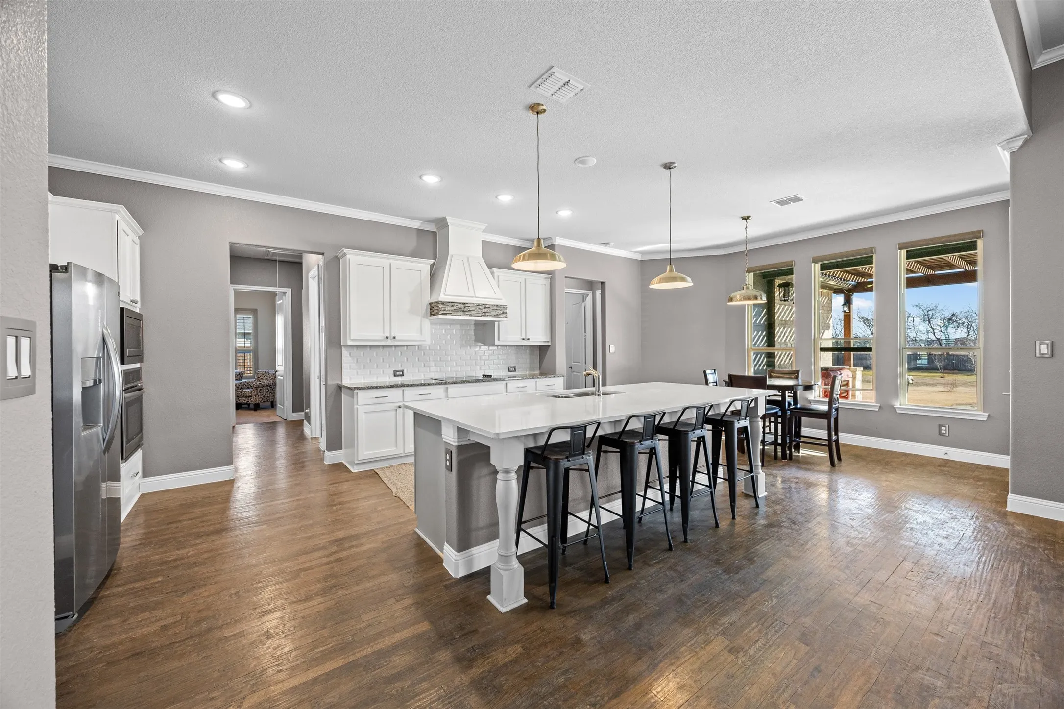 Kitchen and breakfast area with view of backyard