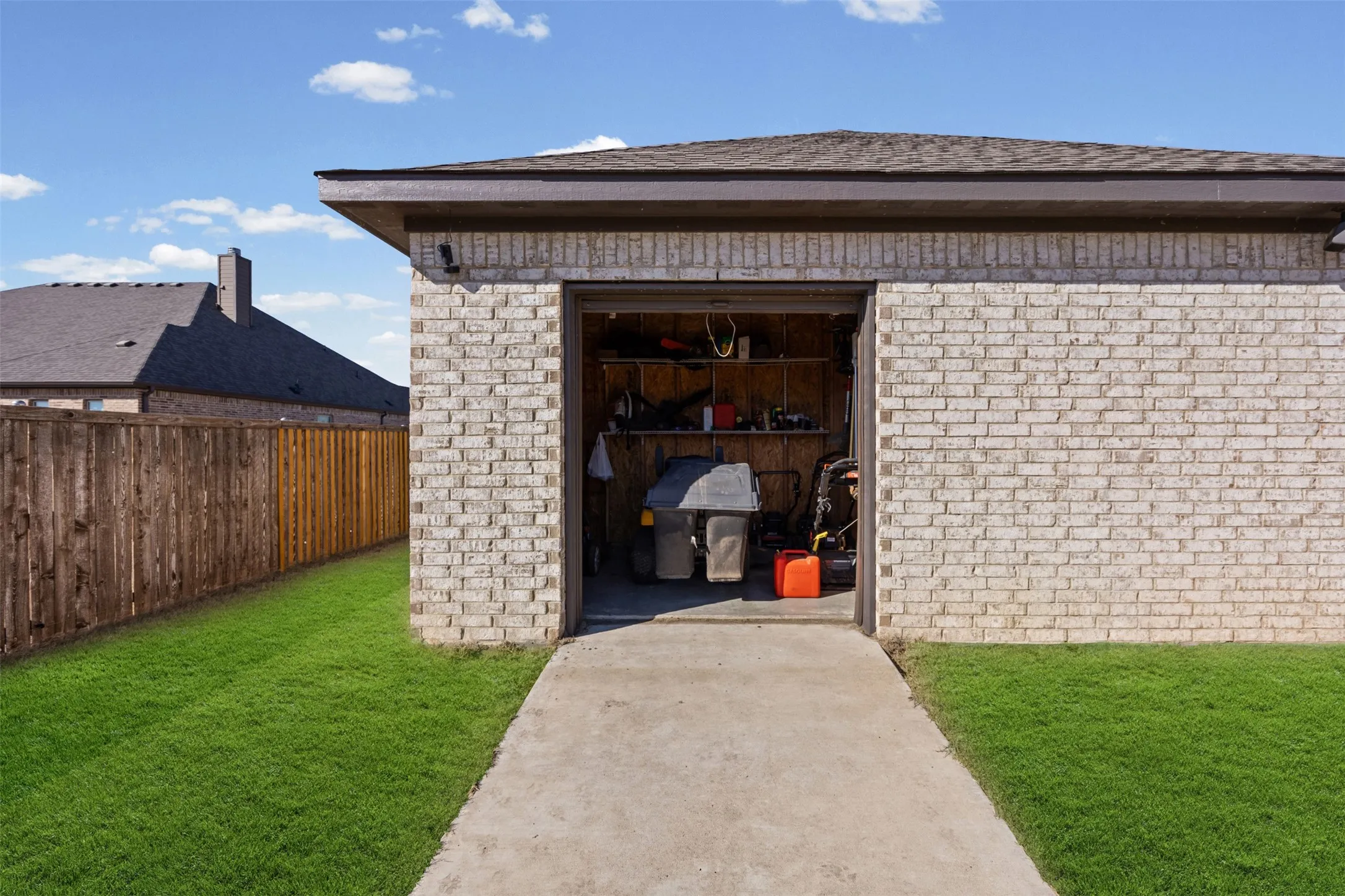 Storage area for yard tools in the back of the shop