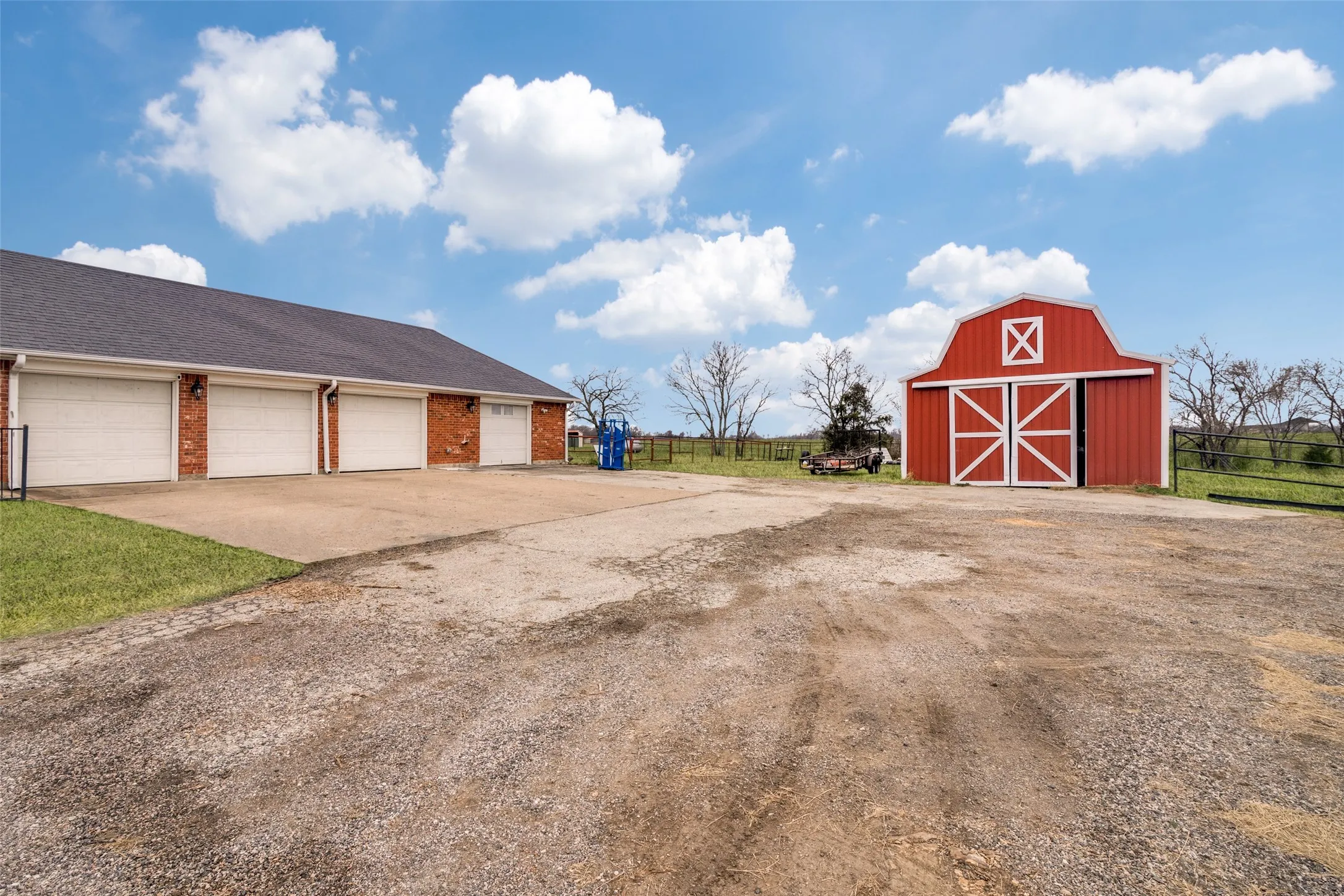 4 car garage and barn.