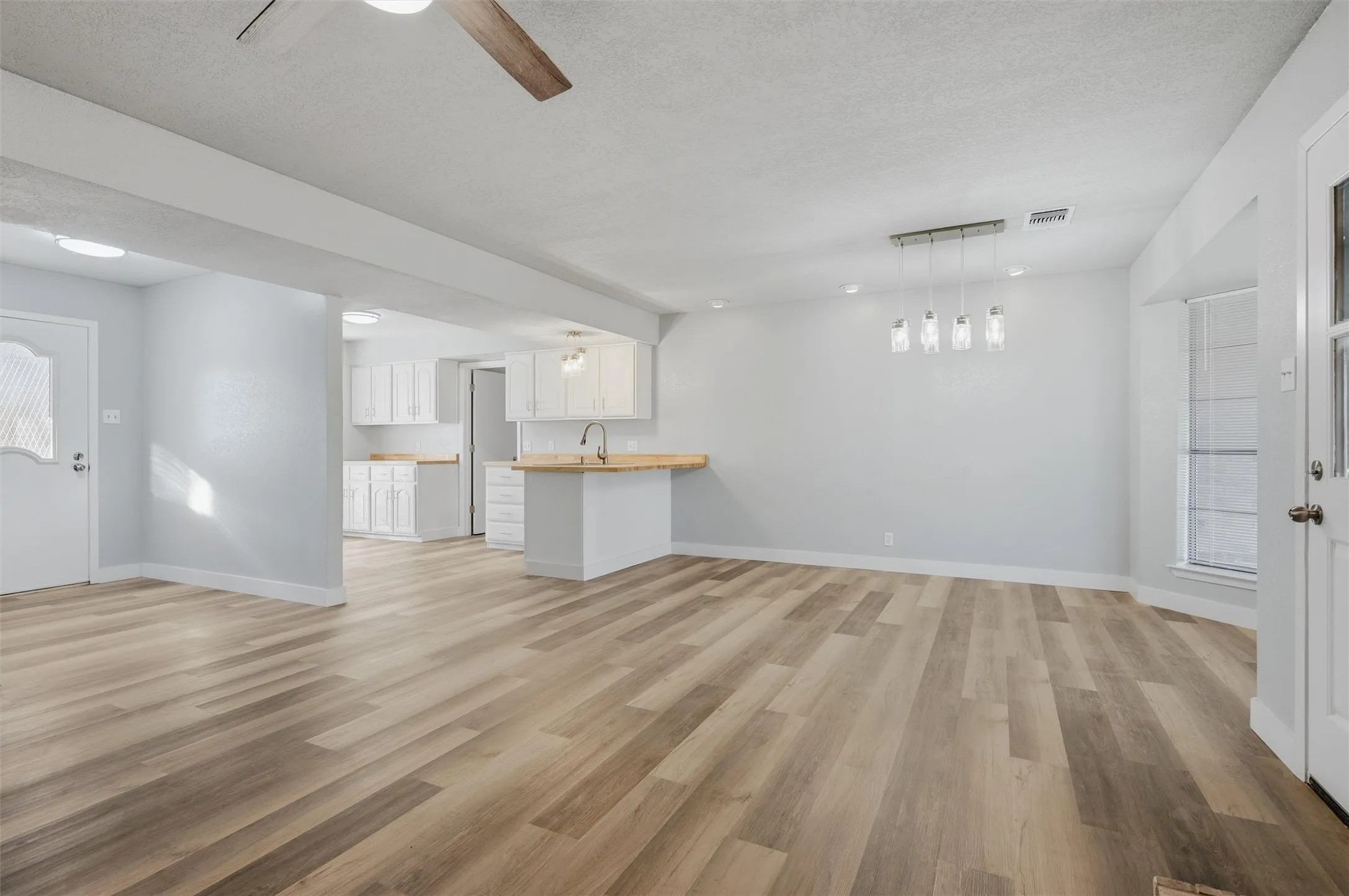 The popcorn ceiling has already been removed and ceilings re-textured