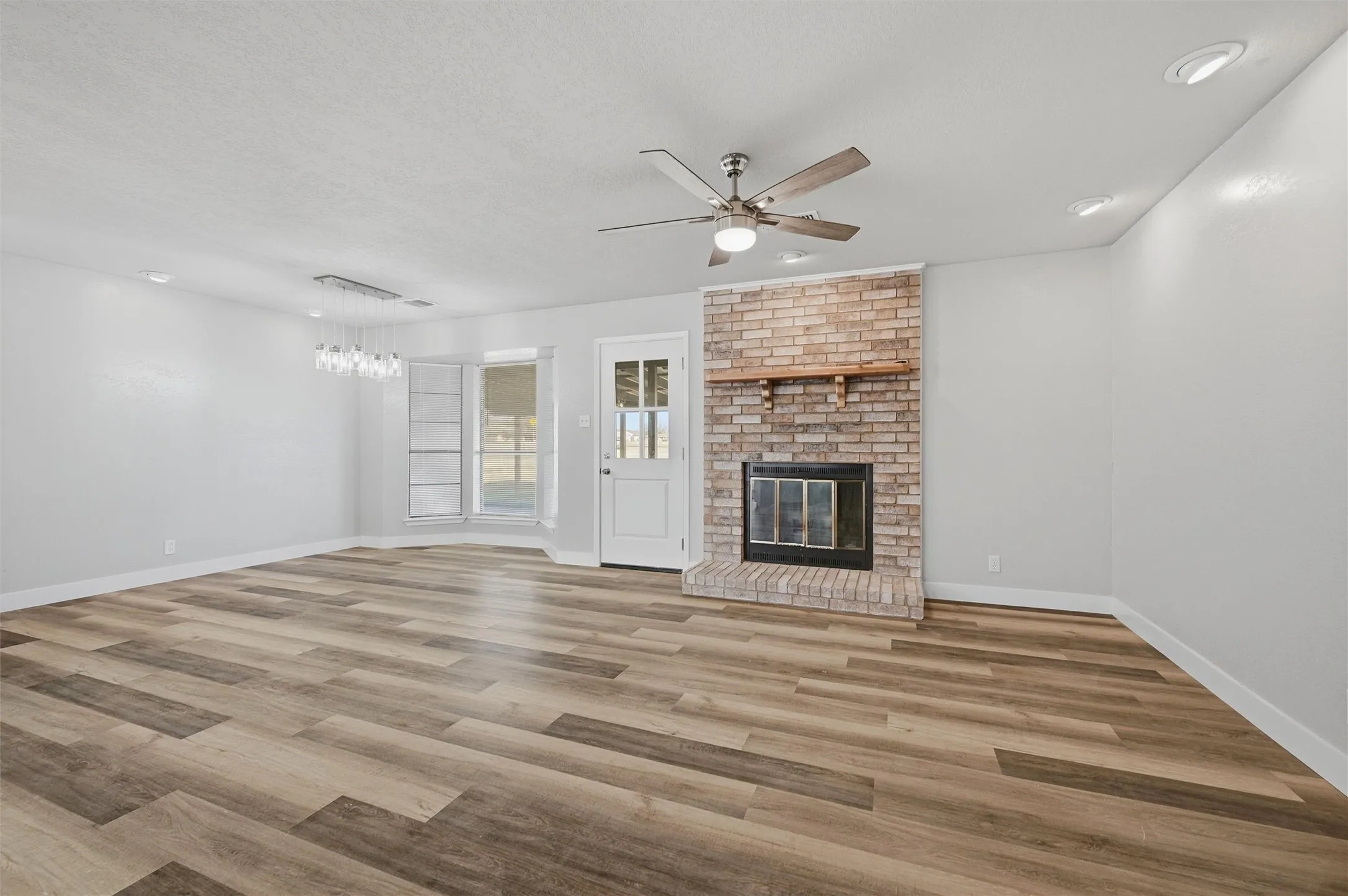 The fireplace was whitewashed, and the mantle stripped down to its original solid wood color for a bright, fresh, updated look