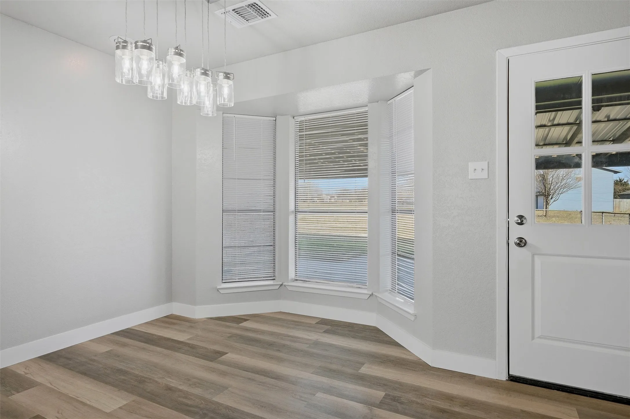 You can enjoy the view of the backyard from the dining area