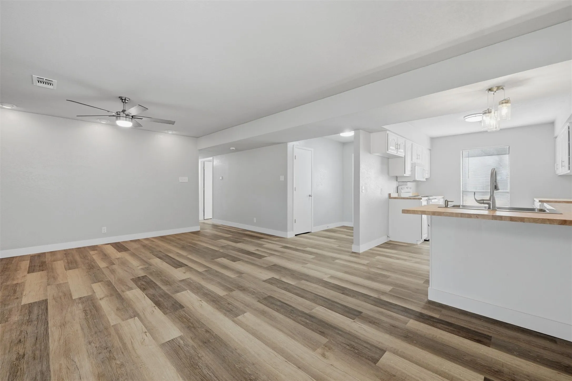 The kitchen is open to both the living and dining rooms