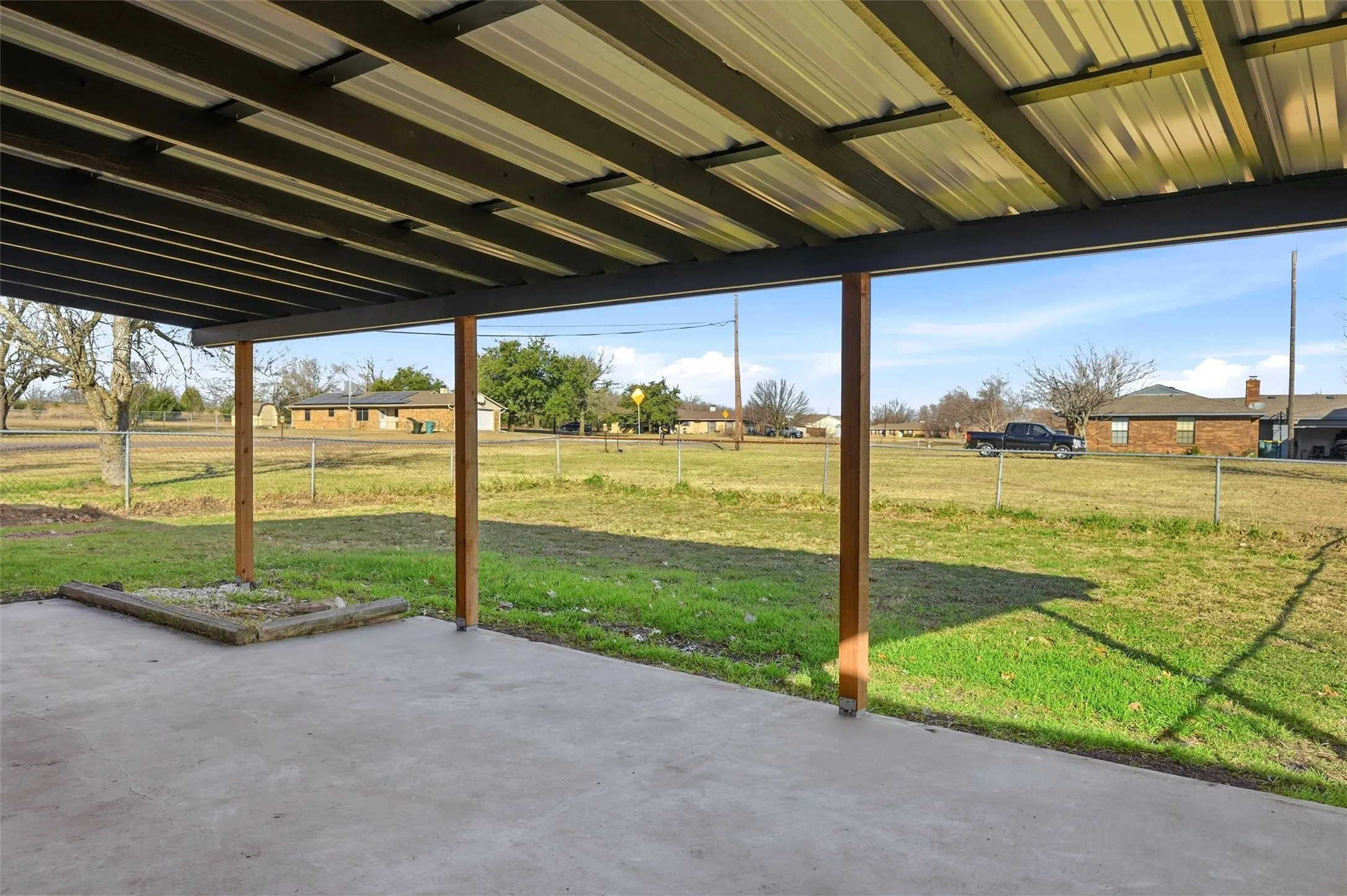 You'll have endless enjoyment on this back patio. The patio cover was replaced with this sturdy metal roof