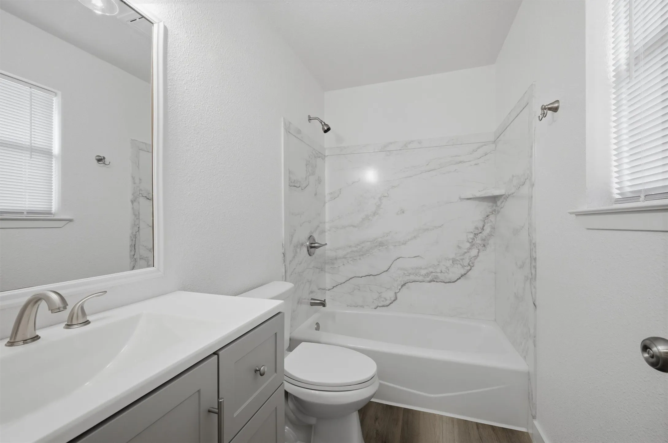 The on-suite is completely re-done with a new vanity, lighting, exhaust fan, tub surround, and toilet